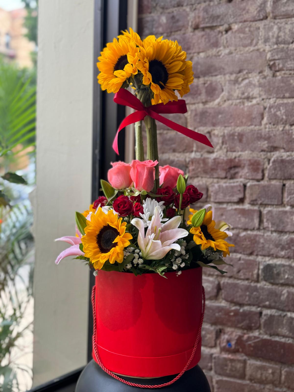 Enchated Garden. - Sunflower arrangement with lilies for any occasion.