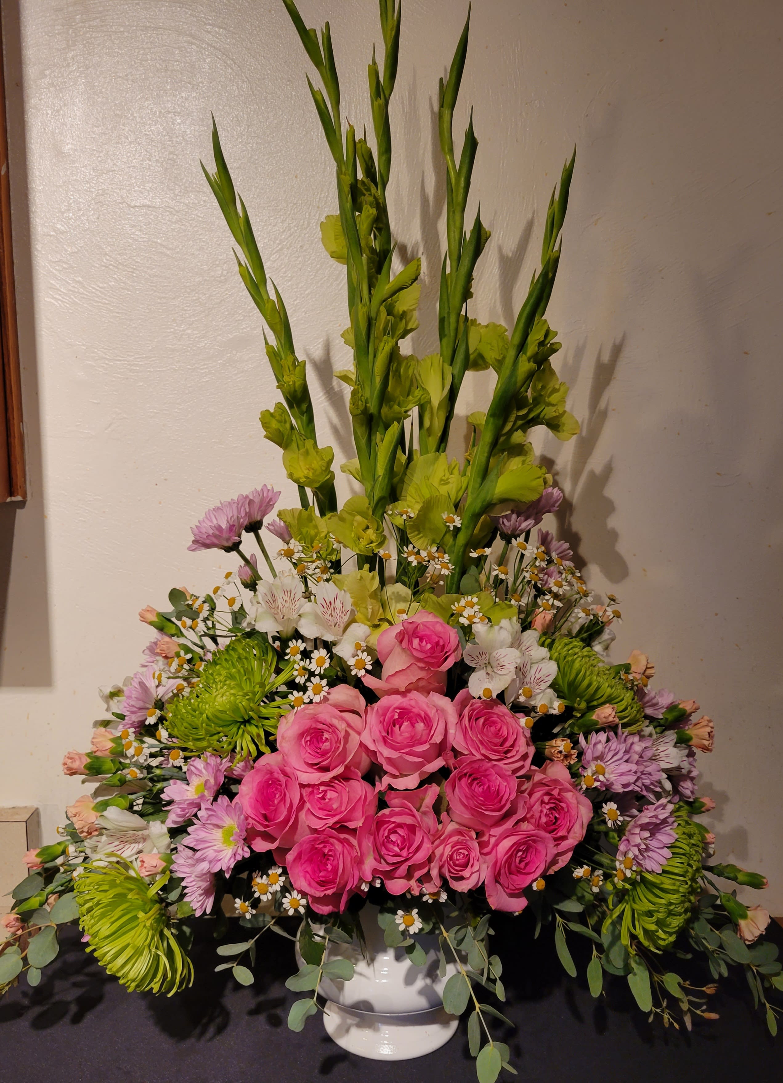 Heartfelt Tribute Arrangement - When you are trying to find a way to express your deepest sympathy, this sympathy basket helps you beautifully say what is in your heart. Our professional designers use only the freshest blooms, includingl roses, gladiolas, alstromeria and more, to show your love and concern for family, friends and colleagues during a difficult time. The arrangement is appropriate for family, friends or business associates to send directly to the funeral home, church or a home memorial service.  To request a specific color scheme, please note in special instructions.