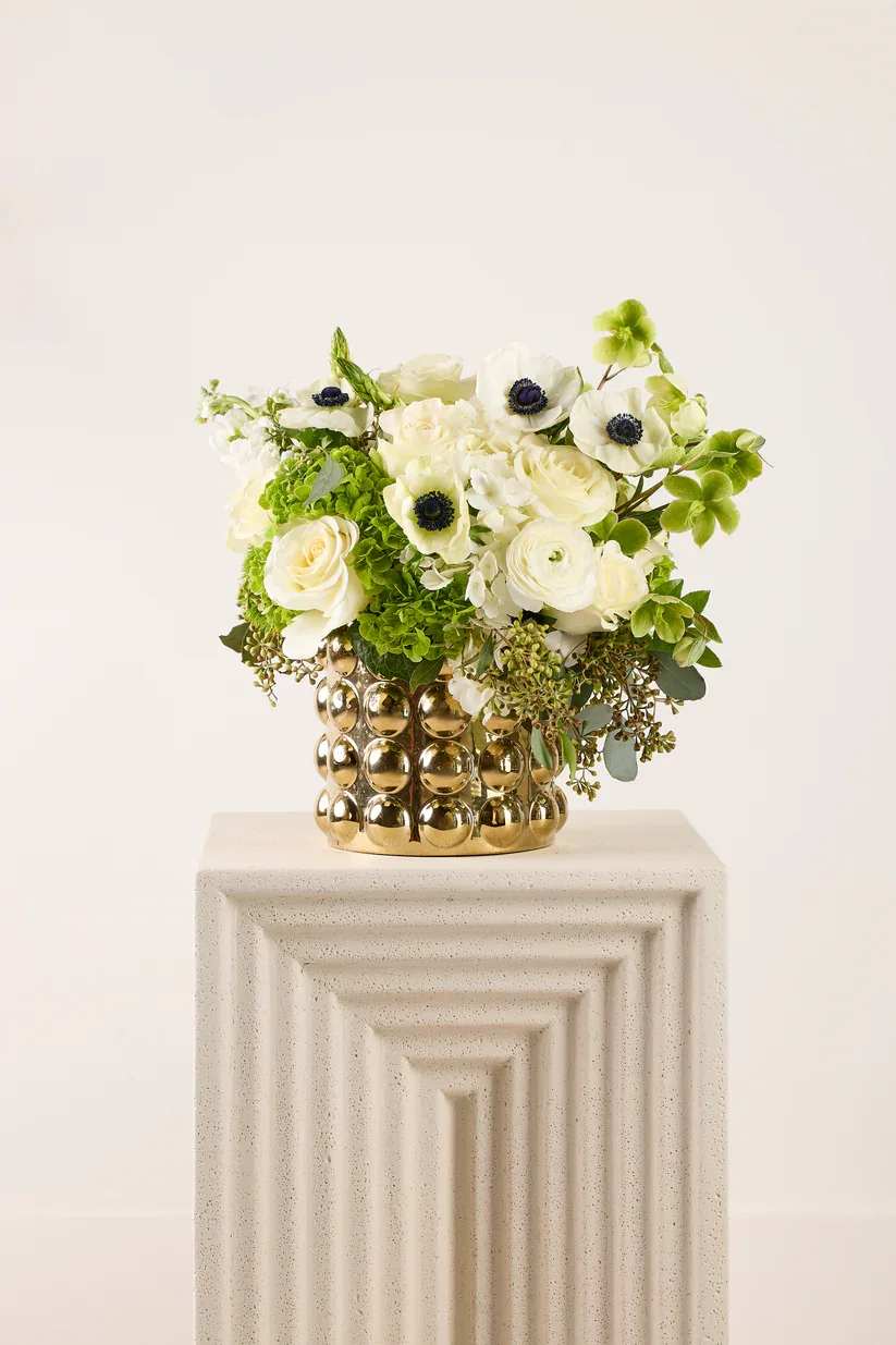 Organic Brass - Our organic brass floral arrangement is a stunning combination of natural beauty and elegant craftsmanship. Our Brass vase, that comes in two different sizes, is a versatile material that adds warmth and sophistication to any space, while organic floral elements bring a touch of nature indoors.  Whether displayed as a centerpiece on a dining table, a focal point on a mantel, or a decorative accent in any room, an organic brass floral arrangement is sure to add a touch of sophistication and charm to your space.