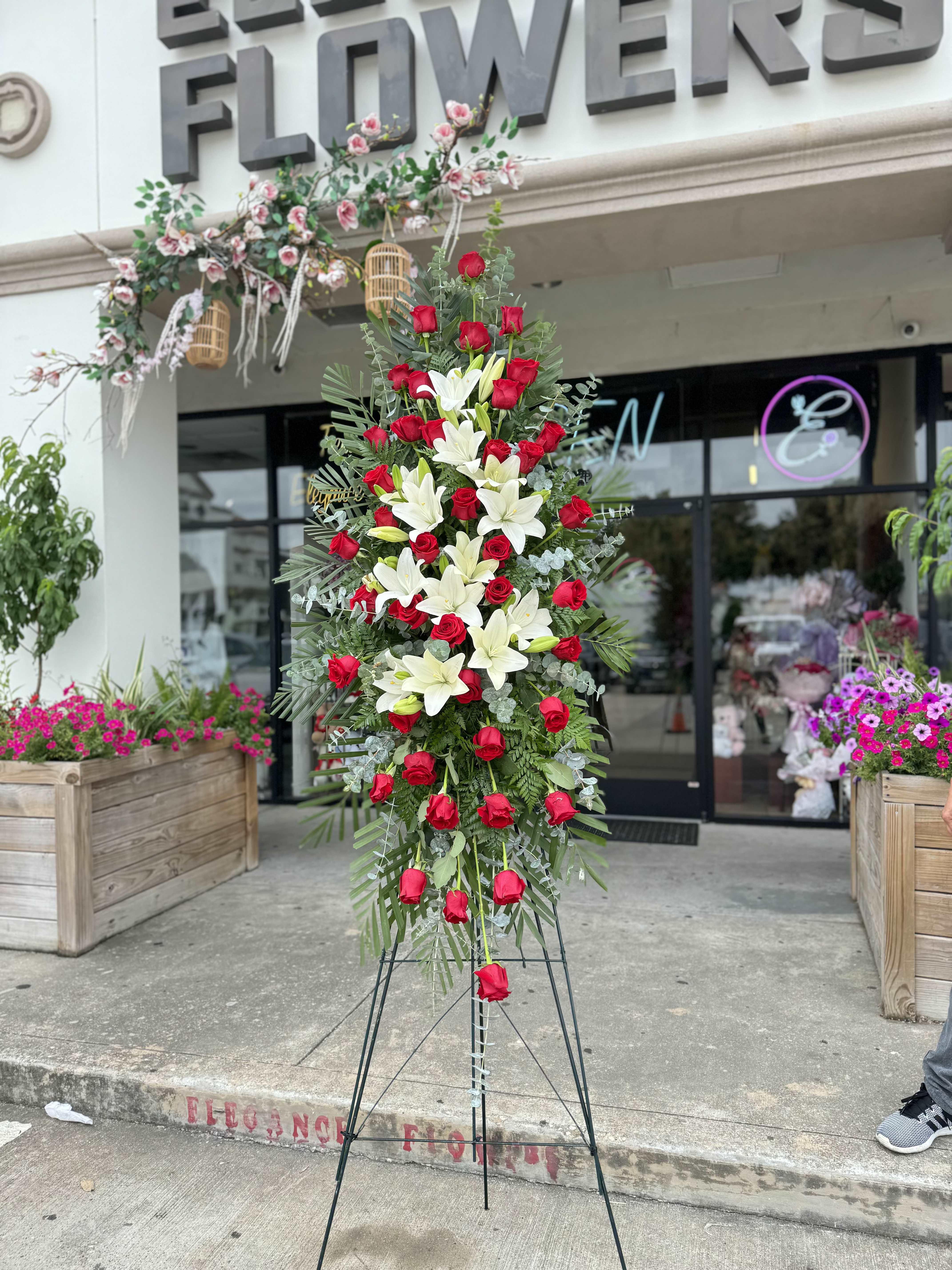 Easel #29 Online Easel #29 Online - A standings flower arrangement for a funeral service is a heartfelt tribute designed to honor and celebrate the life of the deceased. These arrangements are typically displayed on an easel or stand, making them highly visible and a central part of the memorial decor.