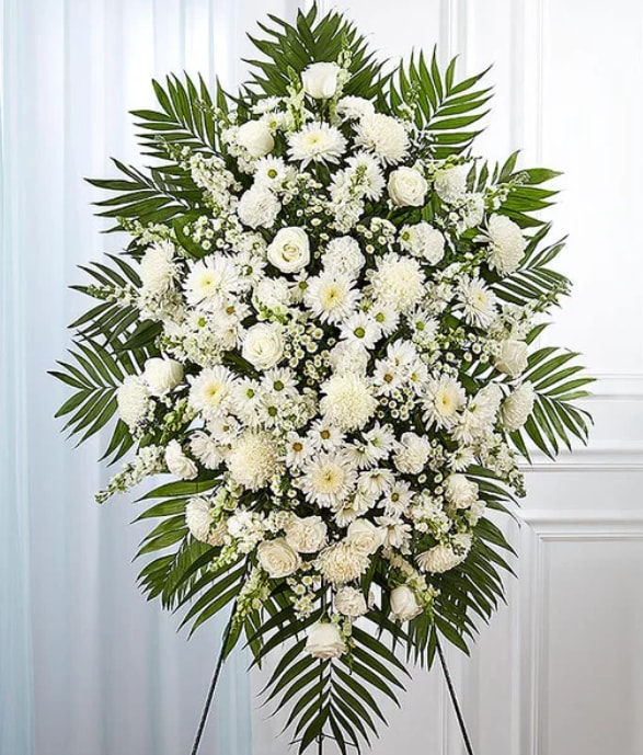 All White Standing Spray - All-white standing spray arrangement with roses, football mums, cremones, stock, snapdragons, carnations, daisy poms and monte casino; accented with soft, lush greenery
