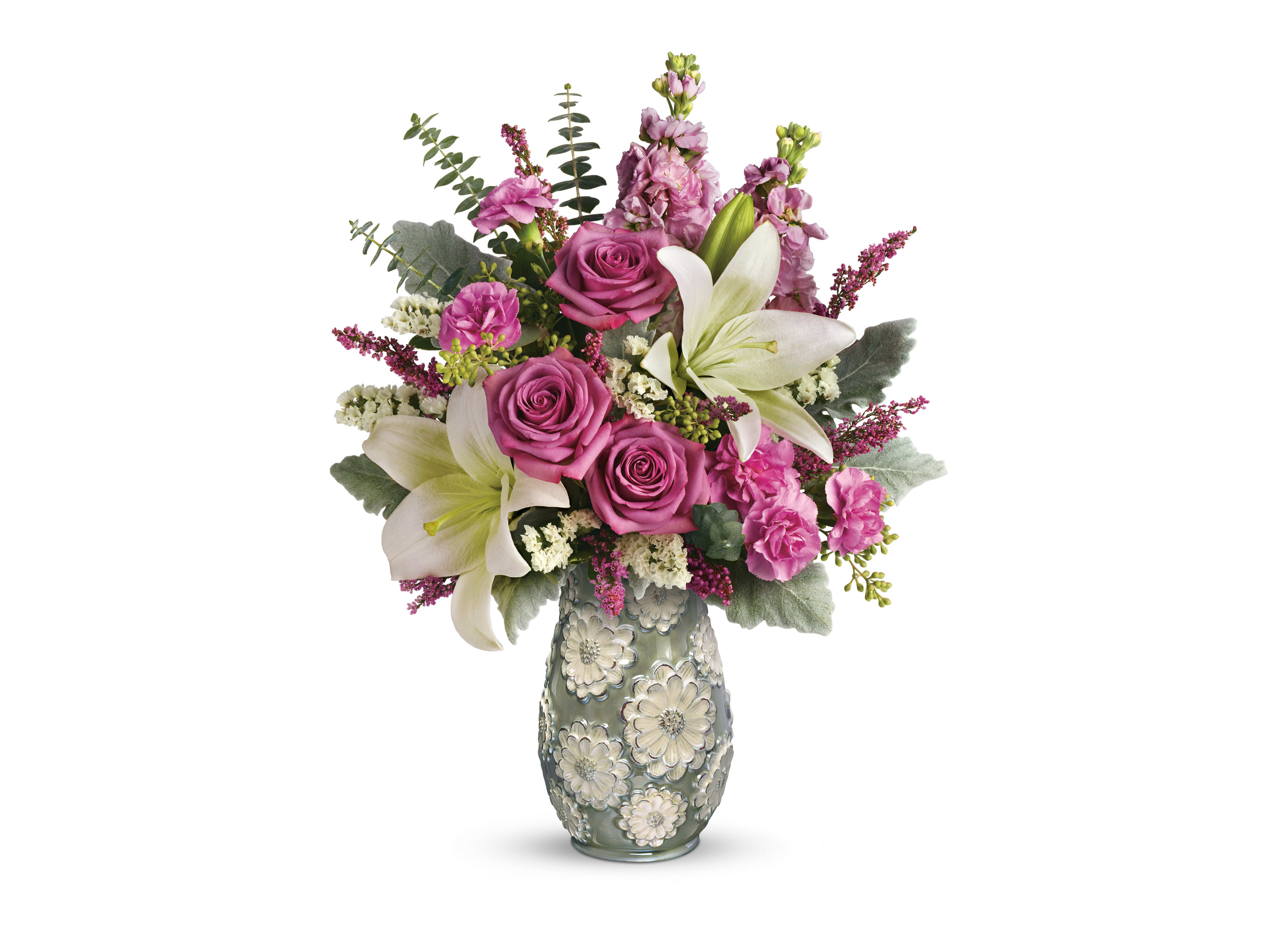 Blooming Spring Bouquet Blooming Spring Bouquet - These lavender roses, white asiatic lilies, pink miniature carnations, and pink stock are beautifully arranged with white sinuata statice, lavender heather, seeded eucalyptus, dusty miller, and spiral eucalyptus.