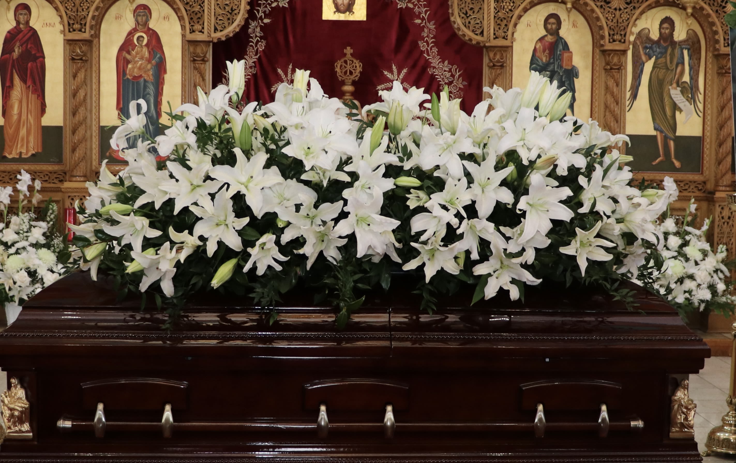 Full Lily Casket Full Lily Casket - This grand casket arrangement showcases lilies with seasonal greenery.