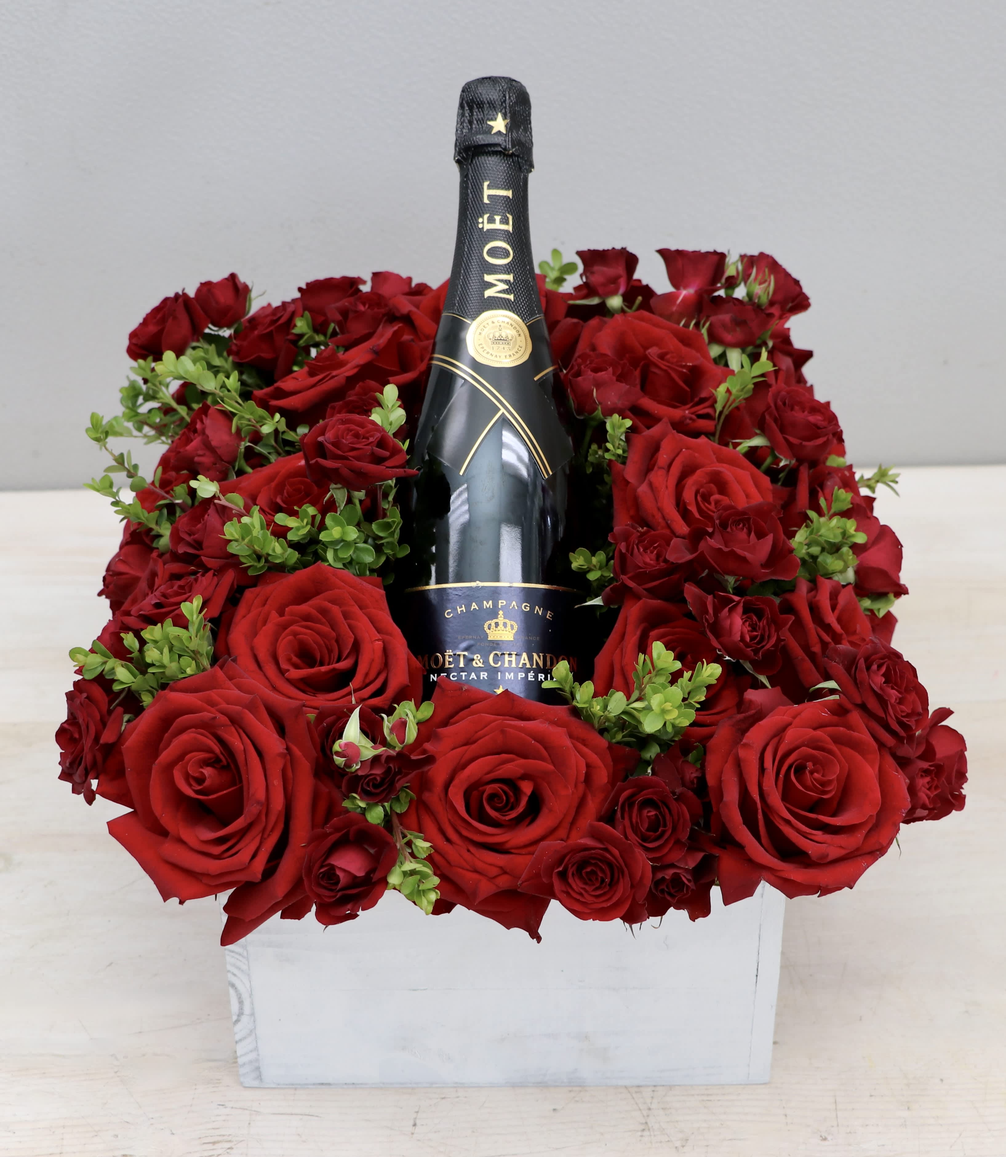 Romantic Red Rose Gift - WeHo - Feature your favorite bottle of bubbly surrounded lush red roses. Perfect for a romantic celebration!  Please call or text about bottle selection