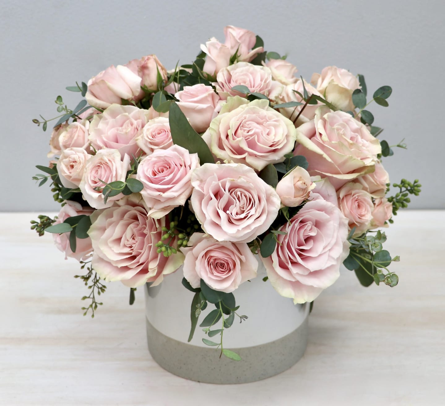 Blush Pink Everything - LA - Pink Hydrangea and roses with seasonal greens. In standard the arrangement is approximately 12'' -14'' tall and wide.