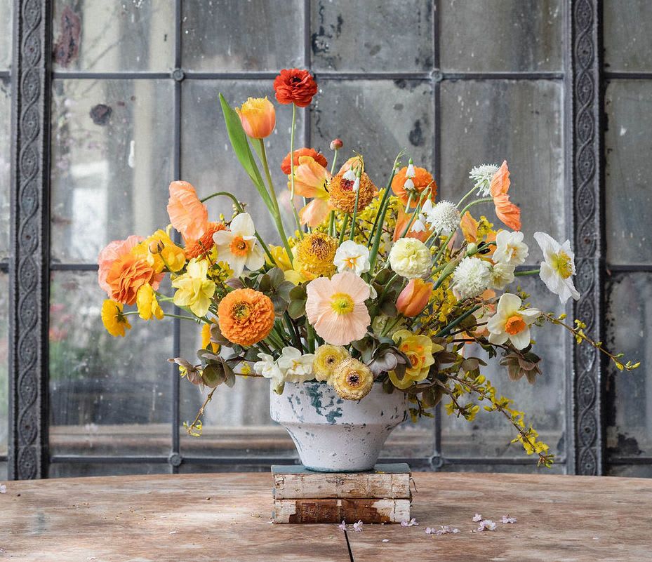Statement Designer' Choice Arrangement in a Vase - Looking to really WOW someone?  Let us do the designing to create a beautiful and bold statement arrangement from the very best of our blooms.  This arrangement will contain the most high-end cut flowers that are seasonally available in a grand, bountiful display -- such as garden roses, peonies, orchids, and/or dahlias.  Our designers will select a neutral glass or ceramic vessel that best houses such an ample array of blooms.  Have a special request?  Let us know in the special instructions and we'll work to make your dream arrangement a reality!