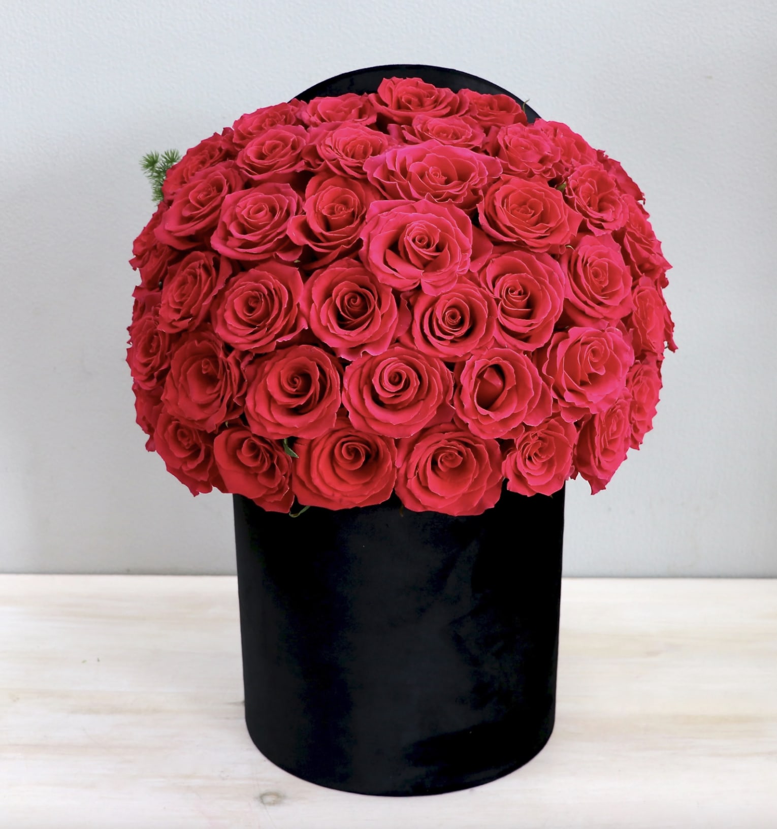 50 Hot Pink Roses Black Hat Box - LA - 50 Premium Ecuadorian hot pink roses perfectly arranged in our new velvet hatbox! Make sure to upgrade to deluxe(75 roses) or premium(100 roses) for more roses!!