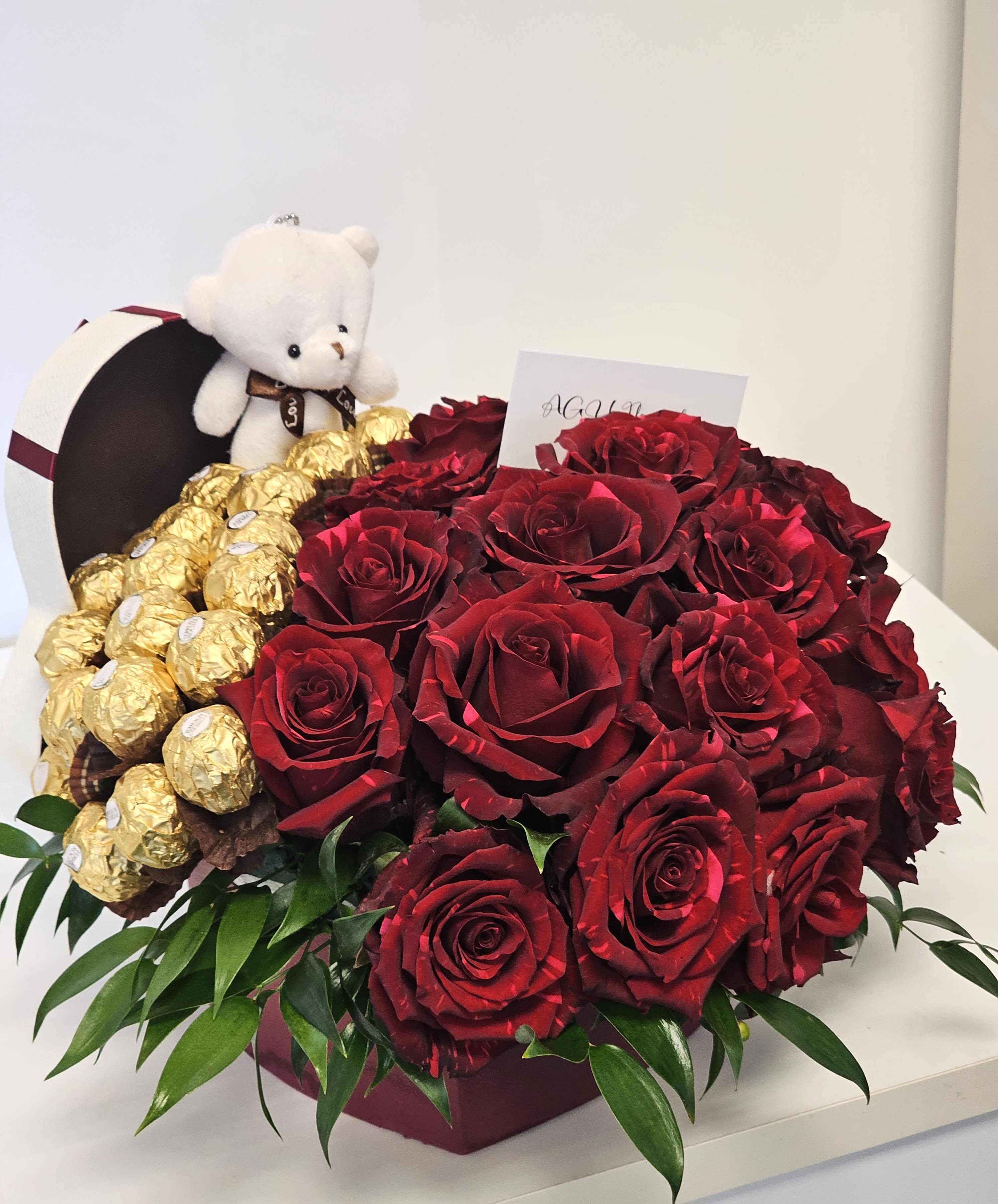 Roses Heart with Candy and with teddy bear  - Our Roses Heart with Candy is the perfect romantic gesture. Featuring a heart-shaped arrangement of lush red roses with candy, it's a sweet and elegant gift. 