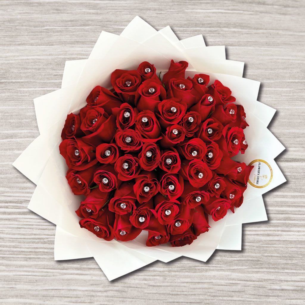Passion’s Flame Passion’s Flame - • Red Roses • Wrap Paper • Gift bow • Luxury diamonds