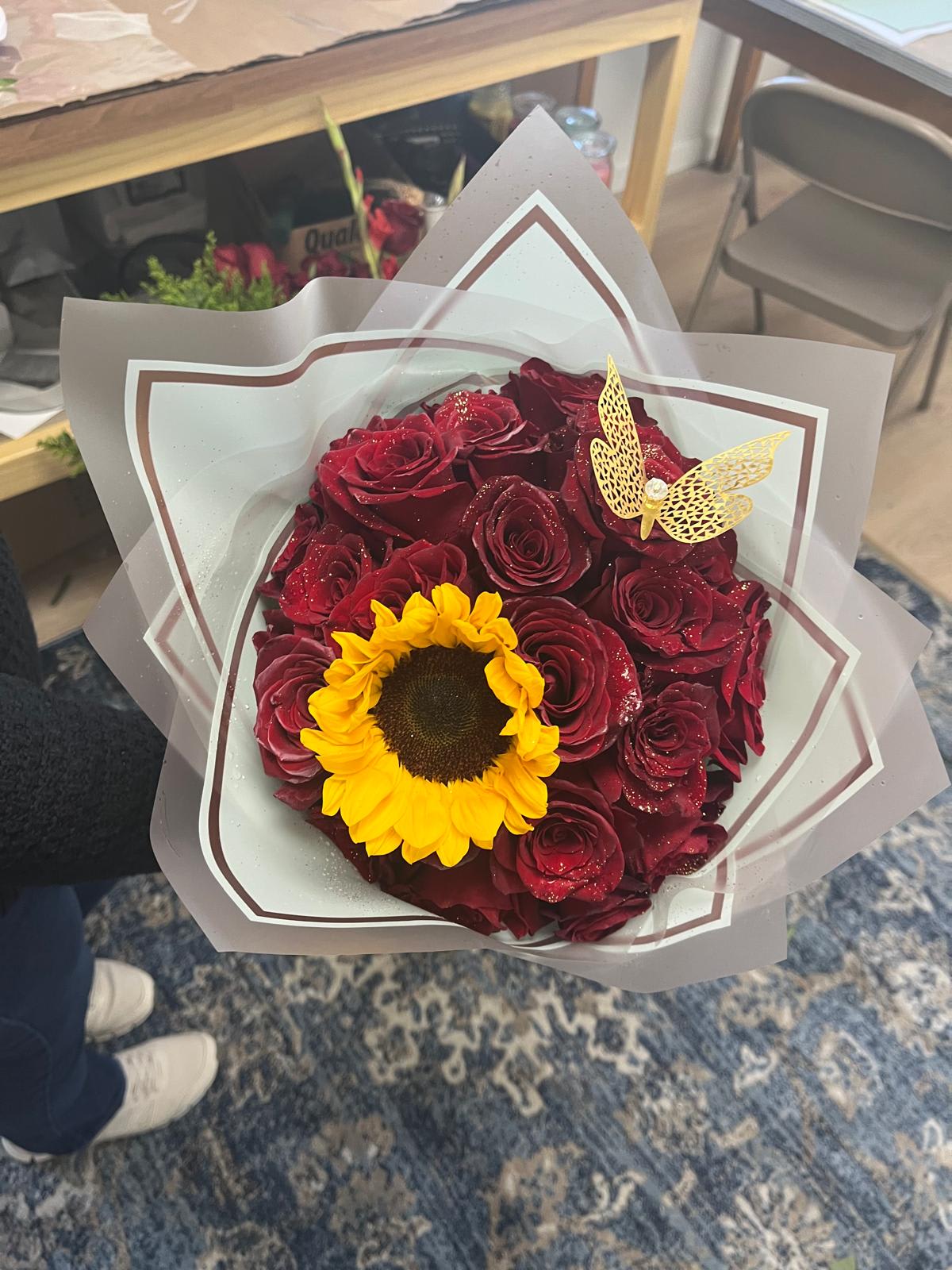 red roses and sunflower bouquet red roses and sunflower bouquet - 24 red roses, 1 sunflower, gold butterfly, gold glitters