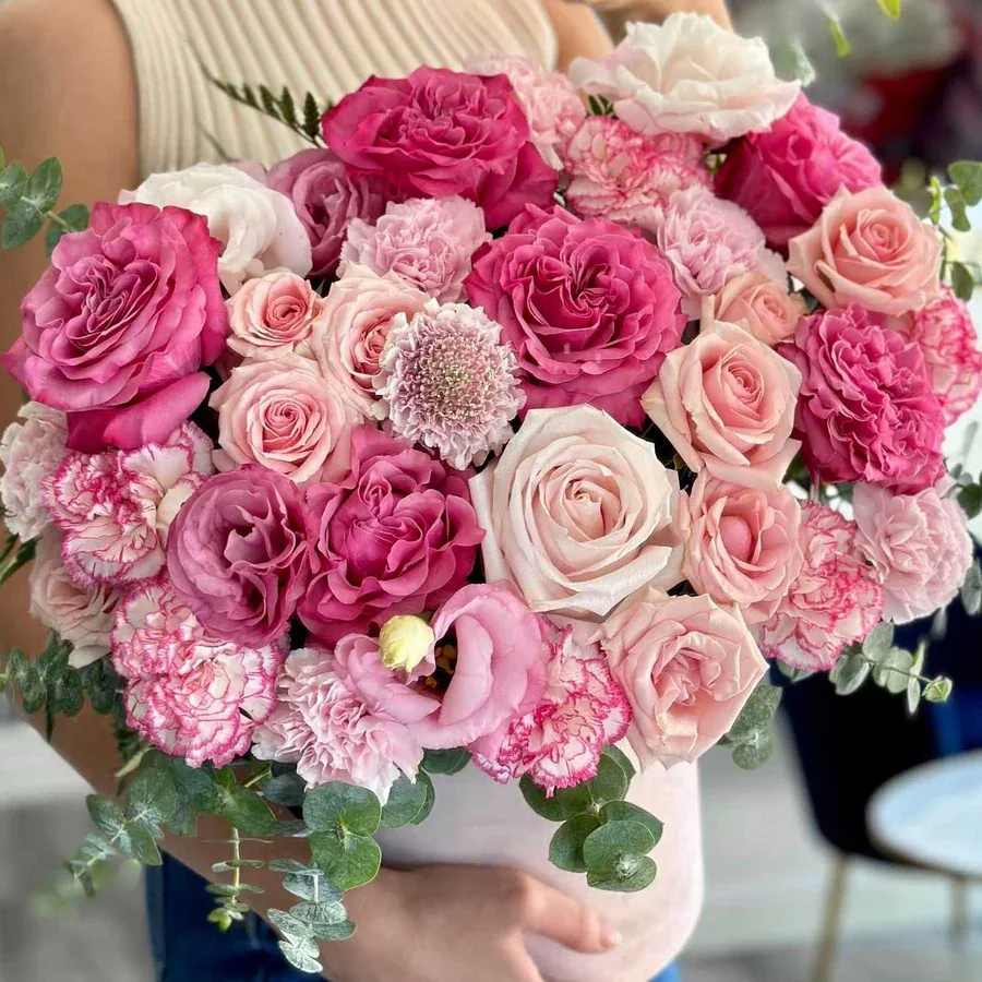Lovely Pink Lovely Pink - Experience the soft elegance of the Lovely Pink arrangement, a delightful blend of various shades of pink roses, scabiosas, and lisianthus. This enchanting floral creation radiates beauty and romance, with the delicate pink tones of the roses symbolizing admiration and love.