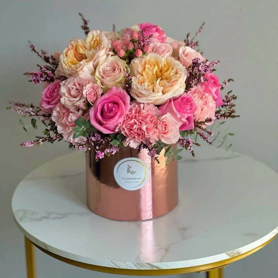 Pink Sunset Pink Sunset - Step into floral beauty with Pink Sunset, a stunning arrangement featuring peony roses, spray roses, hypericum, carnations, genista, and lush greenery. The peony roses, symbolizing romance and good fortune, add elegance with their soft petals, while the spray roses bring subtle charm and contrast.