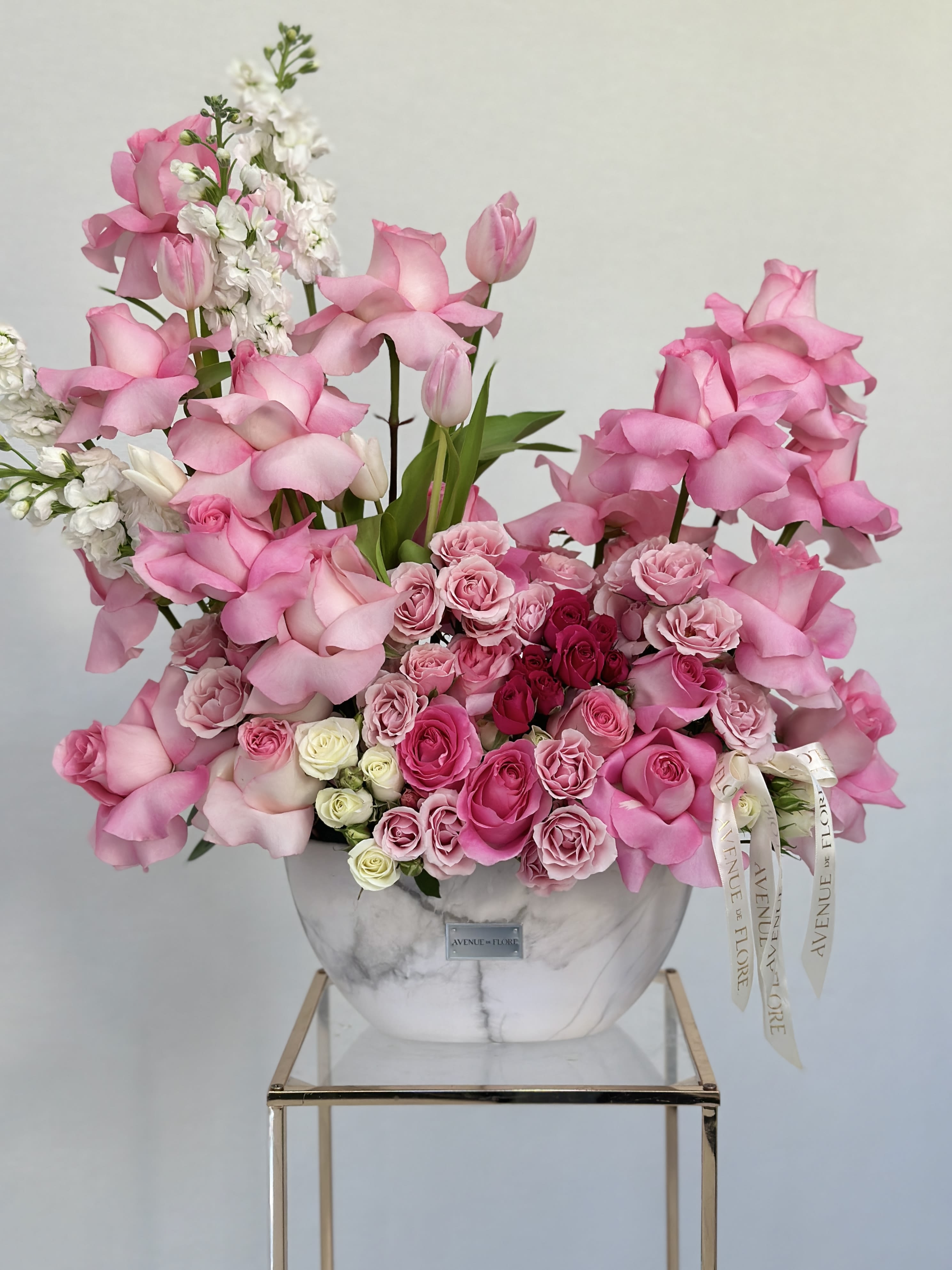 Glamorous &amp; Fabulous - A chic vase adorned with an stunning arrangement of pink roses. The sleek vase complements the soft dreamy pink tones of the roses, bringing an instant pop of glam to any room. It’s the ultimate accessory for adding some chic, Barbie-worthy elegance to any space! Add balloons for the ultimate birthday celebration! 