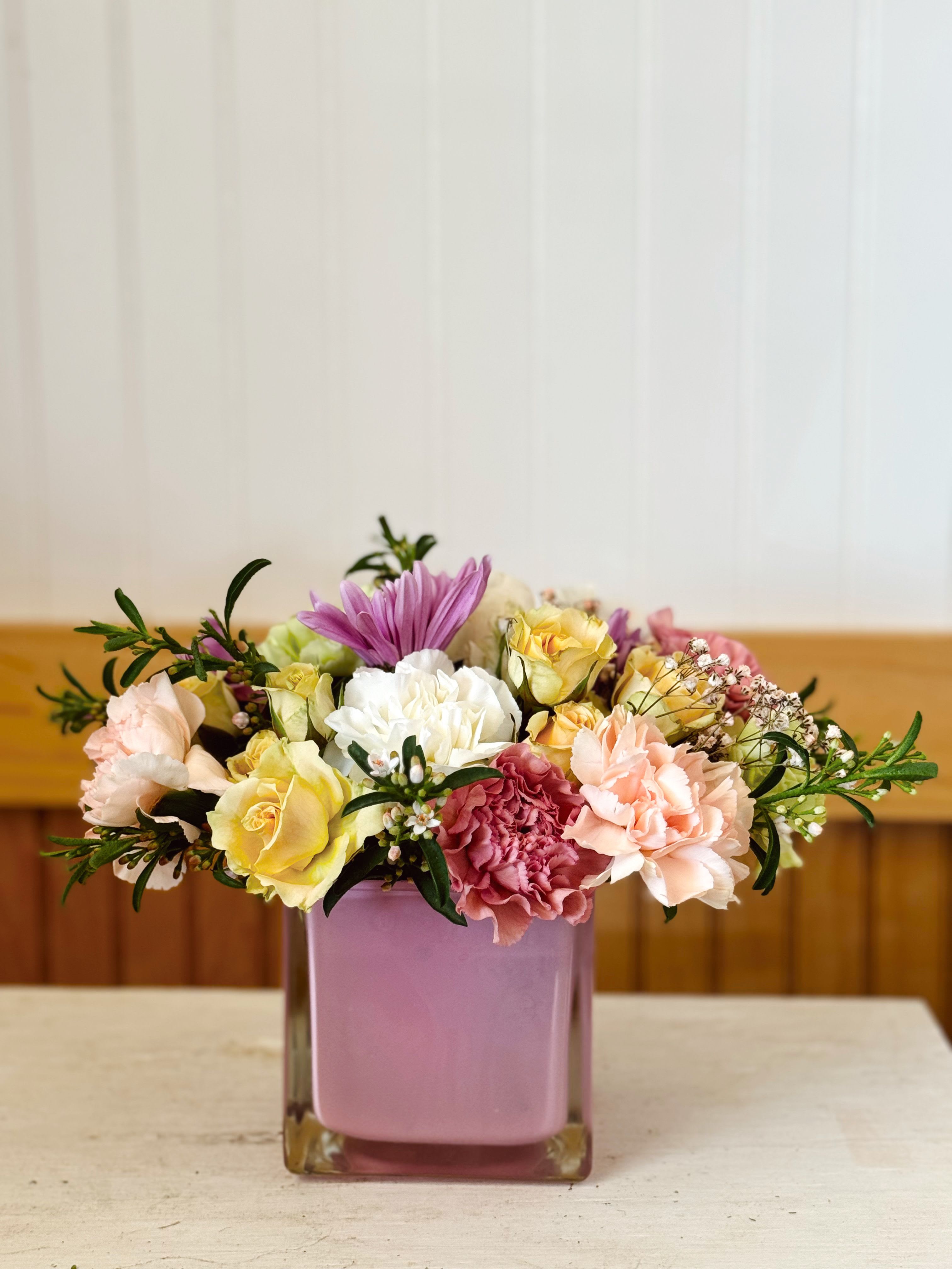 Pretty and pink  - Soft, delicate, and effortlessly charming. A dreamy arrangement in romantic pastel colors. Arranged in a frosted pink glass vase, it’s the perfect gift for celebrating love, friendship, and beautiful moments.