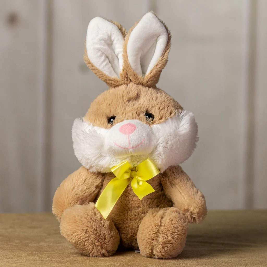 10&quot; Adorable Medium Rabbit - This adorable rabbit sits well, is of medium size, sports a fancy yellow bow tie and a handsome smile. The beige and white fur is soft and bright too. Size - 10 inches tall while sitting, from head to bottom, not including the ears Feel - Soft and cuddly, stuffed with hypoallergenic fiber fill