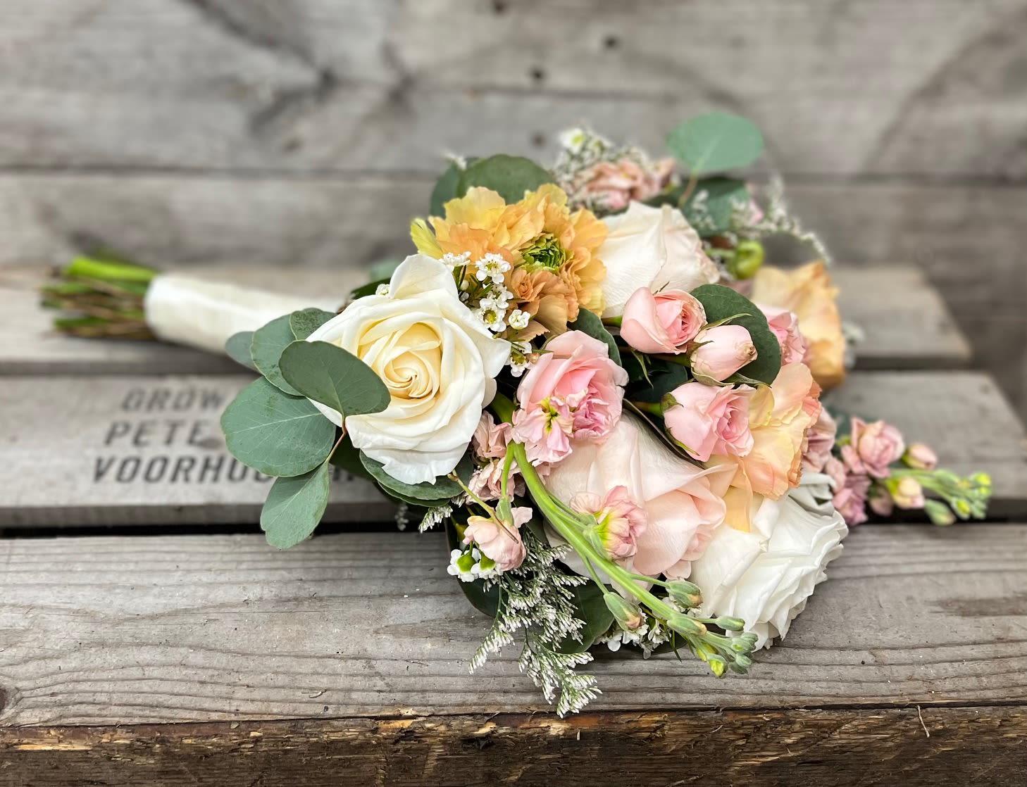 Prom Nosegay - White &amp; Peach - Mix of white, pink &amp; peach flowers arranged beautifully in small handheld handpicked look will have a variety of filler and eucalyptus greens. Stems will be wrapped in your choice color sheer ribbon. Ribbon color is to compliment dress color not exactly match. All bouquets will be finished with light glitter.  Please note in special instructions what color ribbon and any other special requests.  Bouquets typically contain a mix of roses, spray roses, alstroemeria, daisies, stock, hydrangea, snap dragons, carnations, mini carnations, fillers and greens    Bouquet will not match the photo exactly, as each nosegay is uniquely hand made by our designer. Will have same look, feel and size.  