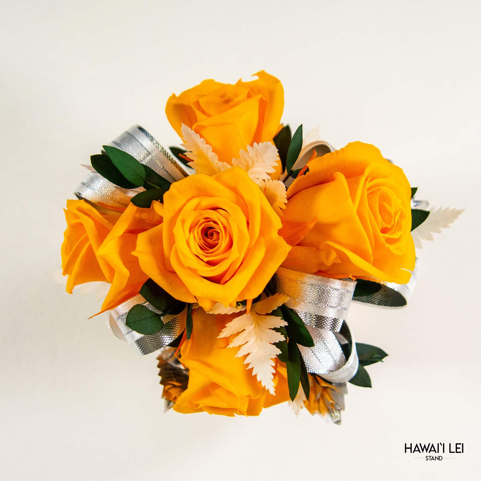 [Call To Order] Beretania's Wrist Corsage - Forever Rose (Premium - Yellow) - Elevate your prom, wedding, or special event ensemble with the exquisite Forever Rose Wrist Corsage from the Hawaii Lei Stand by Beretania Florist. Crafted to perfection, this stunning accessory is a timeless addition to any formal occasion.  Available in a variety of captivating rose colors, our Forever Rose Wrist Corsage offers unparalleled elegance and versatility. Whether you prefer classic red, delicate pink, vibrant white, blue, yellow and lavender there's a shade to complement every style and aesthetic.  What sets this corsage apart is its longevity. Unlike wrist corsages made with fresh roses, our Forever Rose Wrist Corsage features preserved roses, ensuring that its beauty endures for years to come with proper care. Imagine cherishing the memory of your special day as you preserve this exquisite corsage as a timeless keepsake.  To maintain the beauty of your Forever Rose Wrist Corsage, keep it away from direct sunlight and refrain from storing it in the refrigerator. Additionally, ensure it remains dry to prolong its lifespan and retain its stunning appearance.  Make a lasting impression at your next event with the Forever Rose Wrist Corsage from Hawaii Lei Stand by Beretania Florist. Embrace elegance and create cherished memories that will be treasured for a lifetime.
