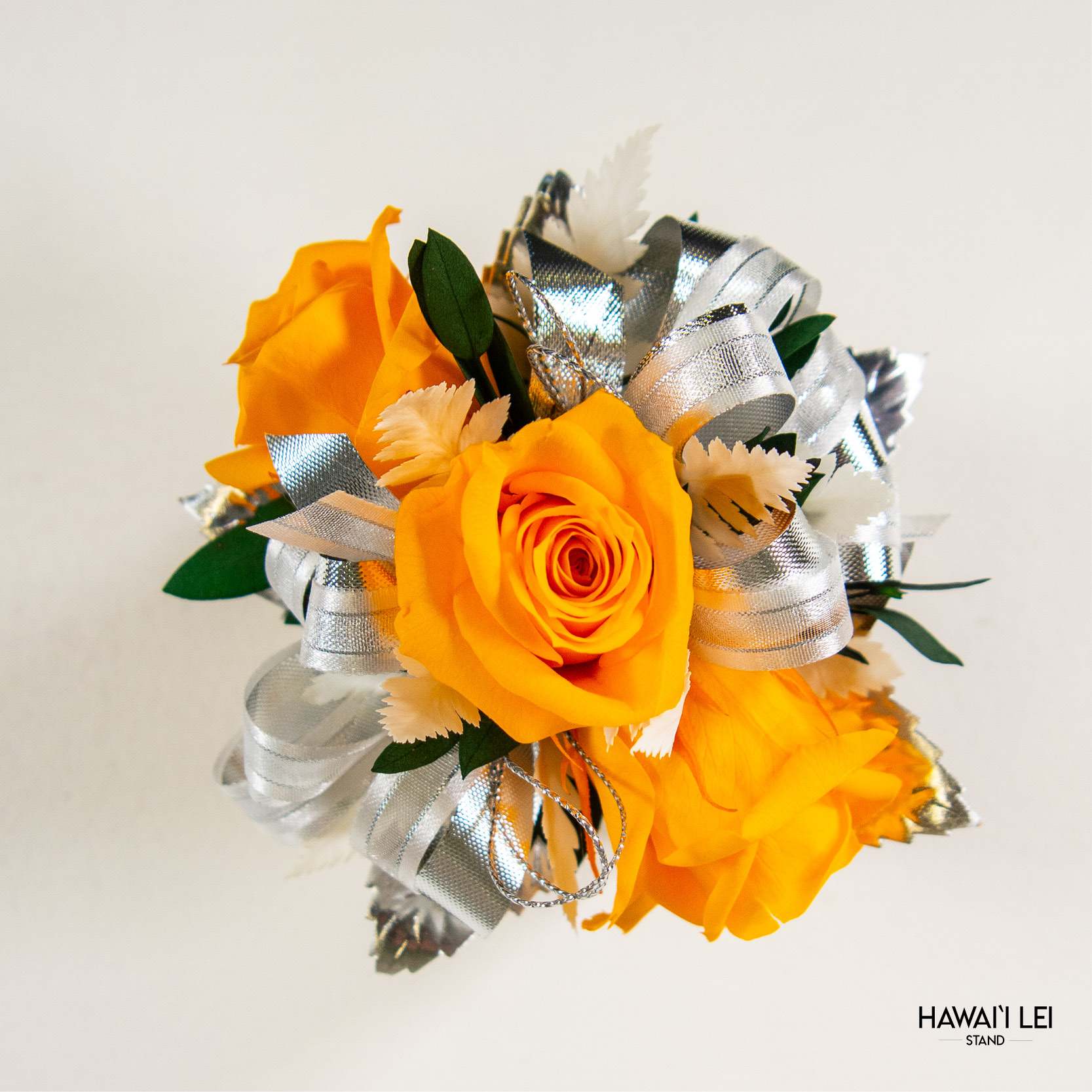 [Call To Order] Beretania's Wrist Corsage - Forever Rose (Classic - Yellow) - Elevate your prom, wedding, or special event ensemble with the exquisite Forever Rose Wrist Corsage from the Hawaii Lei Stand by Beretania Florist. Crafted to perfection, this stunning accessory is a timeless addition to any formal occasion.  Available in a variety of captivating rose colors, our Forever Rose Wrist Corsage offers unparalleled elegance and versatility. Whether you prefer classic red, delicate pink, vibrant white, blue, yellow and lavender there's a shade to complement every style and aesthetic.  What sets this corsage apart is its longevity. Unlike wrist corsages made with fresh roses, our Forever Rose Wrist Corsage features preserved roses, ensuring that its beauty endures for years to come with proper care. Imagine cherishing the memory of your special day as you preserve this exquisite corsage as a timeless keepsake.  To maintain the beauty of your Forever Rose Wrist Corsage, keep it away from direct sunlight and refrain from storing it in the refrigerator. Additionally, ensure it remains dry to prolong its lifespan and retain its stunning appearance.  Make a lasting impression at your next event with the Forever Rose Wrist Corsage from Hawaii Lei Stand by Beretania Florist. Embrace elegance and create cherished memories that will be treasured for a lifetime.