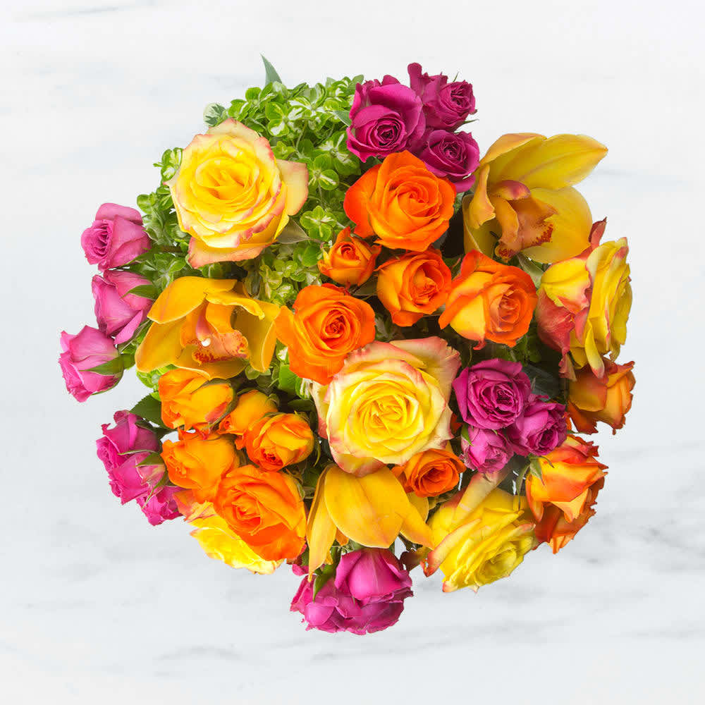 Abundance  - This cylindrical vase of flowers is kind of like a time capsule, if time were made of flowers. What a wonderful “time” that would be. In the season of changing plants, leaves, and flowers, this cylinder of bright abundance reminds us of the beauty that comes with the changing of the seasons. Spoiler alert: that’s a lot of beauty.