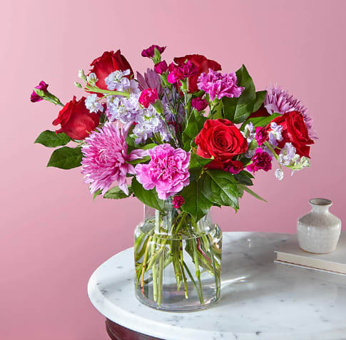 My Everything Bouquet My Everything Bouquet - Show them they mean the world to you with this ample blend of red roses and purple carnations in a cinched glass vase.