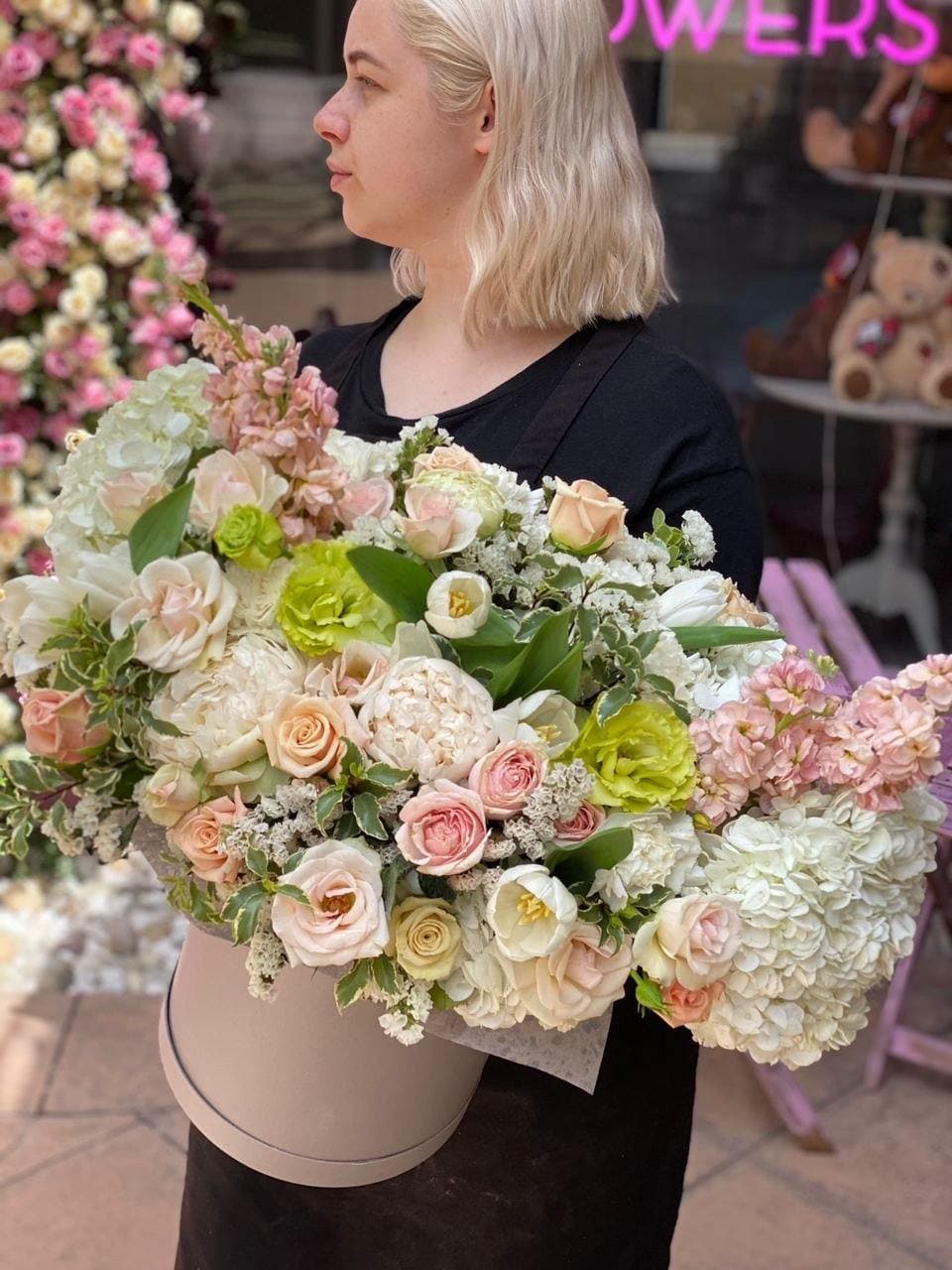 Gifita - Gifita is a stunning and big arrangement that consists of white hydrangea, tulips, garden roses and some greenery in a box. 