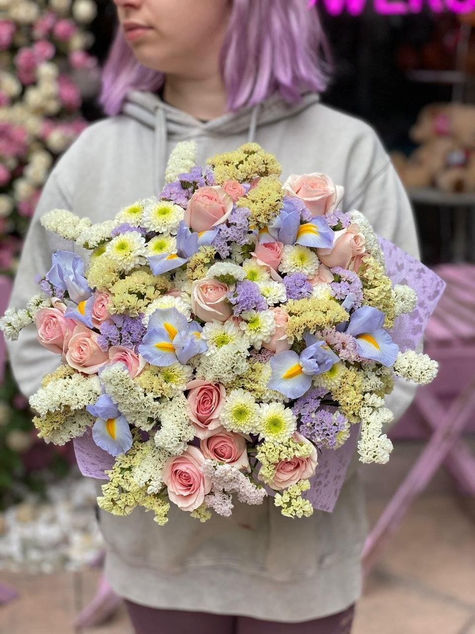 Kate - Kate is a beautiful composition of the mix of roses, irises, carnations and stachys flowers in a clear glass vase. 