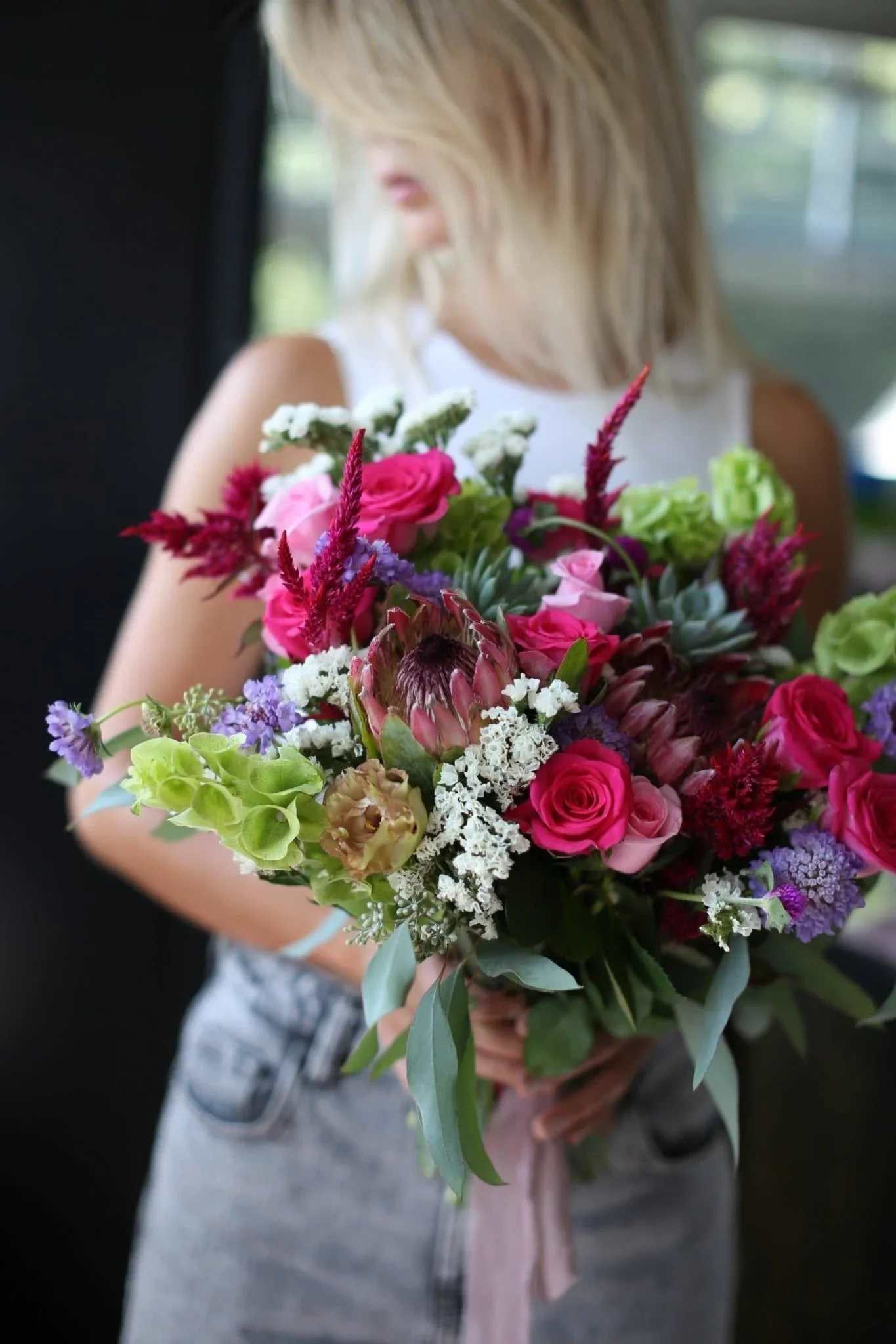 Eden - The best exotic bouquet's made of roses, proteas, succulents, eucalyptus, statice bloom, greenery and other gorgeous flowers. The primary colors are red, rosy, purple, white, green and violet. It is great for any occasions like sympathy, a bridal bouquet, Thanksgiving Day, thank you, birthday and etc. 