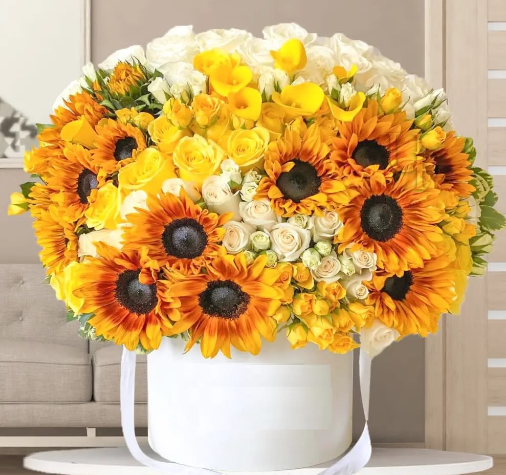 Brighten someone's day arrangement Brighten someone's day arrangement - Brighten someone's day with this vibrant bouquet. Sunflowers symbolize loyalty, longevity, and admiration. Their bright, bold appearance makes them a symbol of joy and warmth, evoking feelings of happiness and positivity. This arrangement is perfect for celebrations, sending well wishes, or expressing gratitude and appreciation in a sunny, delightful sunflowers, white roses, with green fillers and eucalyptus