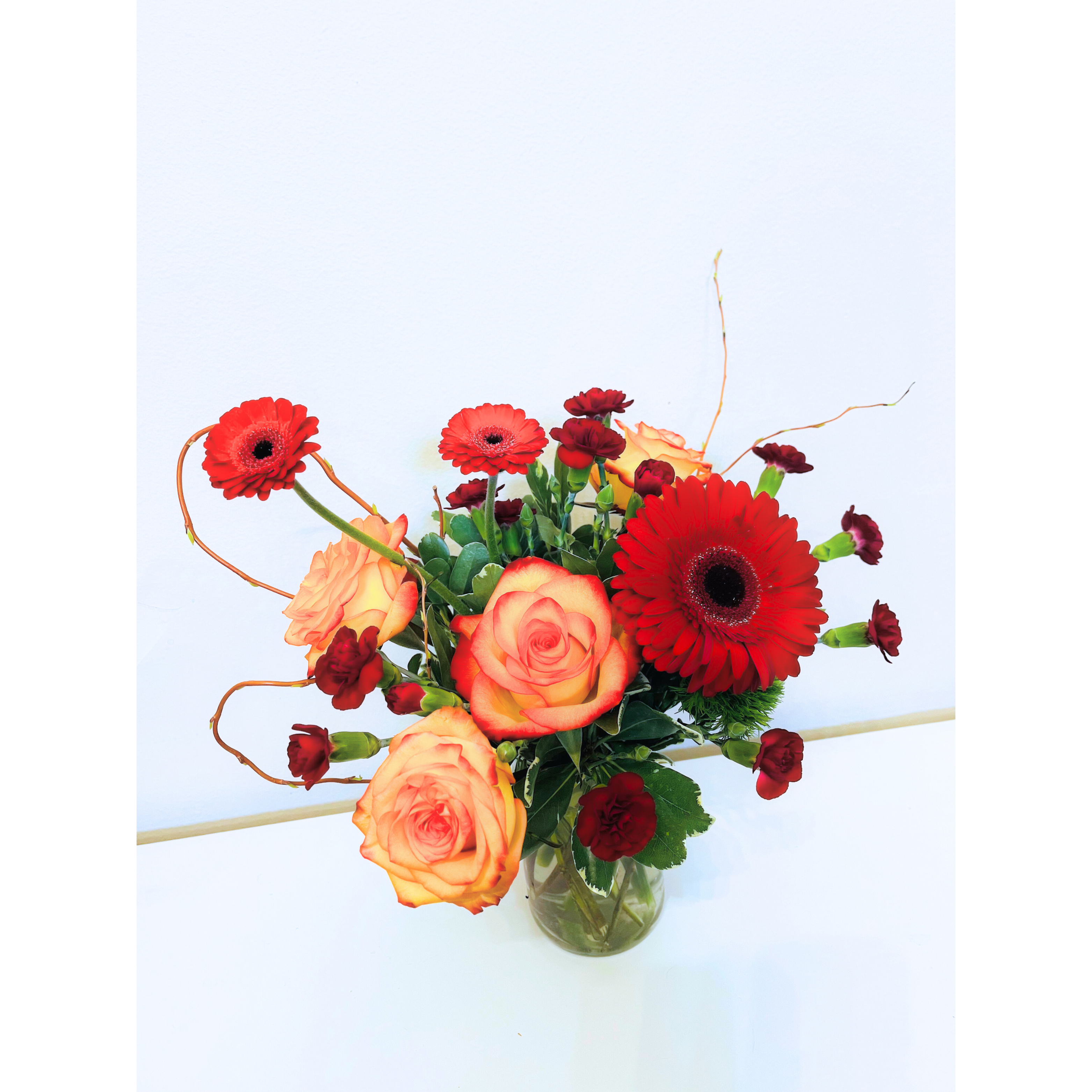 Velvet Touch - A rich and sophisticated design featuring deep maroon and burgundy tones, evoking warmth and elegance. Lush textures and velvety petals create a luxurious feel, perfect for making a bold yet refined statement. Ideal for romantic gestures, celebrations, or adding a touch of timeless beauty to any space.