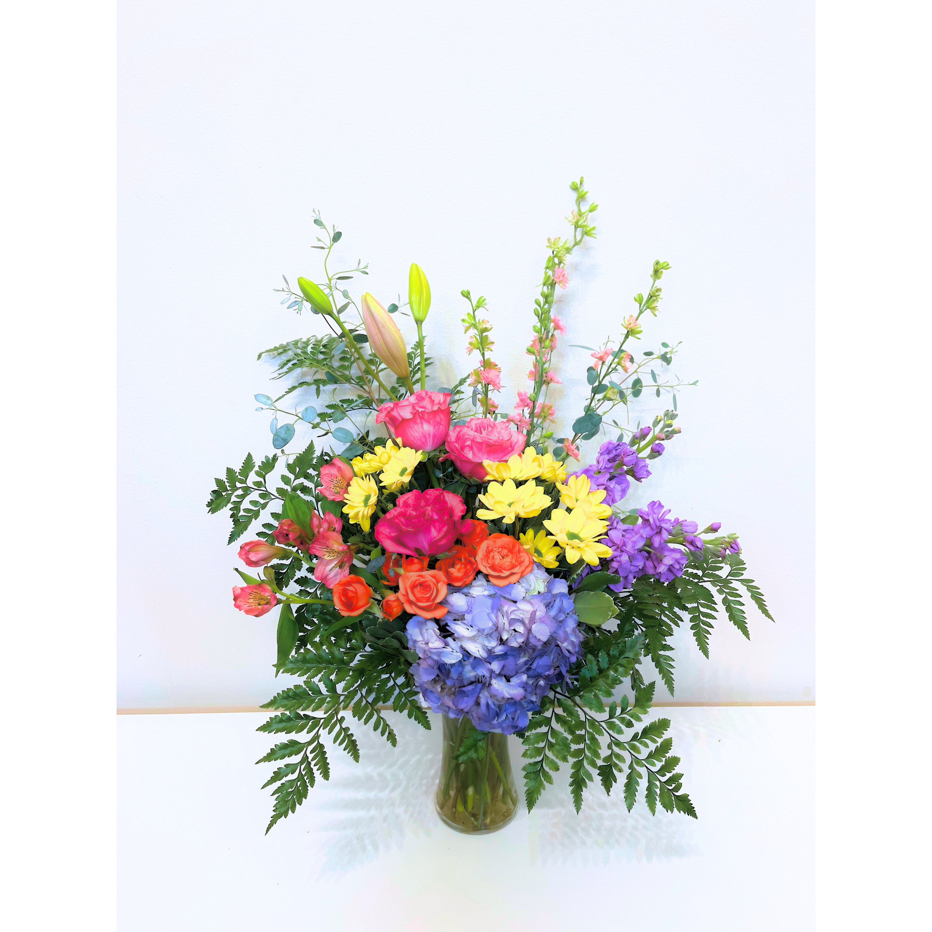 Bright Wishes Bouquet - Bursting with cheerful sunflowers, bright daisies, and lively carnations, this vibrant bouquet is designed to spread joy and warmth. Whether it’s a birthday, a celebration, or a simple gesture to brighten someone’s day, these radiant blooms bring smiles and happiness wherever they go!