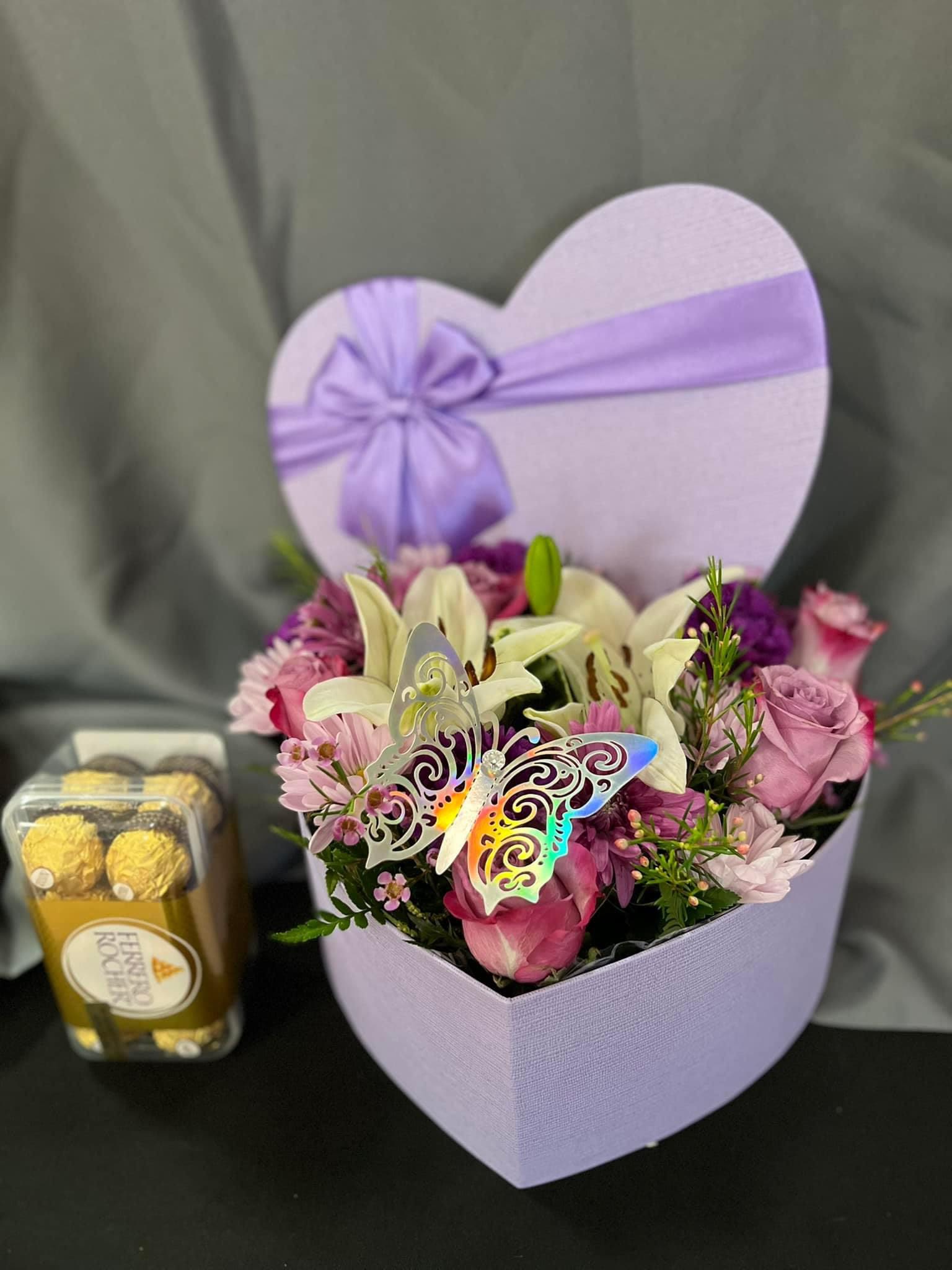 Hard purple Hard purple - Beutiful for any ocassion box with mix flowers lavander and white with butterfly for any celebration