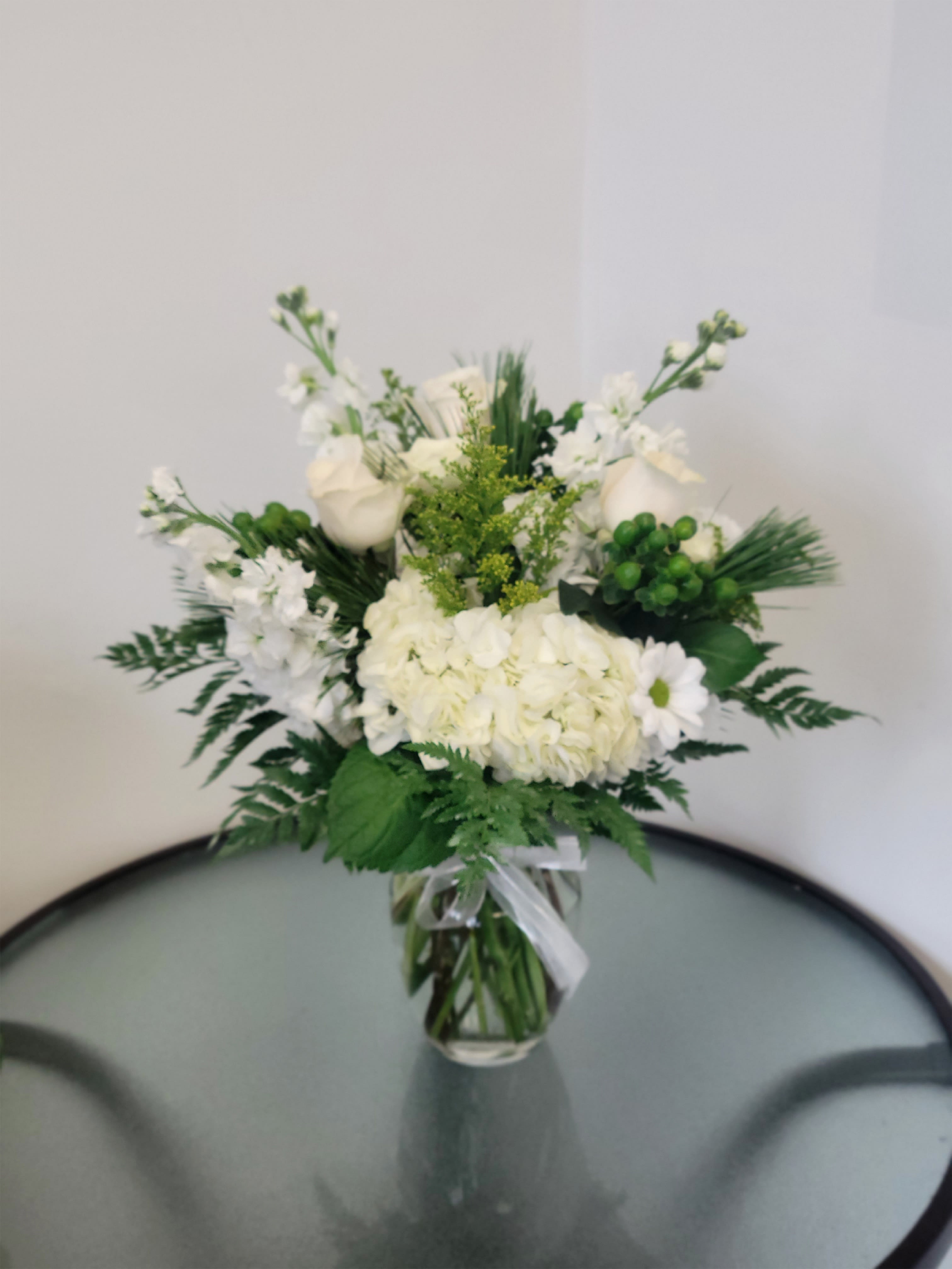 Christmas in white and green Christmas in white and green - Beautiful arrangement with hydrangeas, stocks and white roses with green hypericum, solidago and pine as green foliage Similar flowers and colors