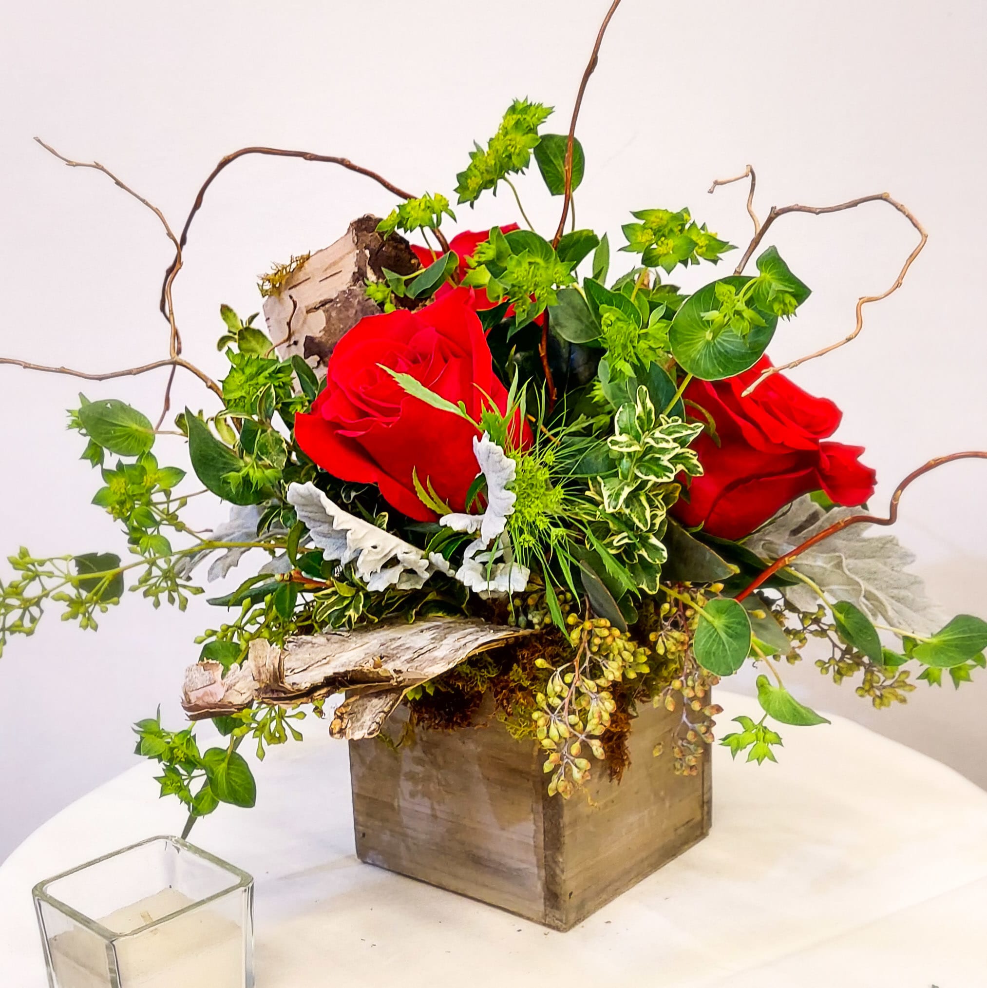 Woodland Rose - Earthy. Natural. Unique.   Finest quality roses nestled in a bed of fresh green moss and assorted foliage. Designed in a rustic wooden box with locally-grown curly willow branches and birch bark accents. Low, fresh contemporary design.   *SYMPATHY/FUNERAL: PLEASE NOTE THE TIME, PLACE, &amp; NAME OF THE DECEASED FOR THE SERVICE IN THE SPECIAL NOTES SECTION OF YOUR ORDER - WE ARE UNABLE TO GUARANTEE DELIVERY TIME WITHOUT THIS.* 