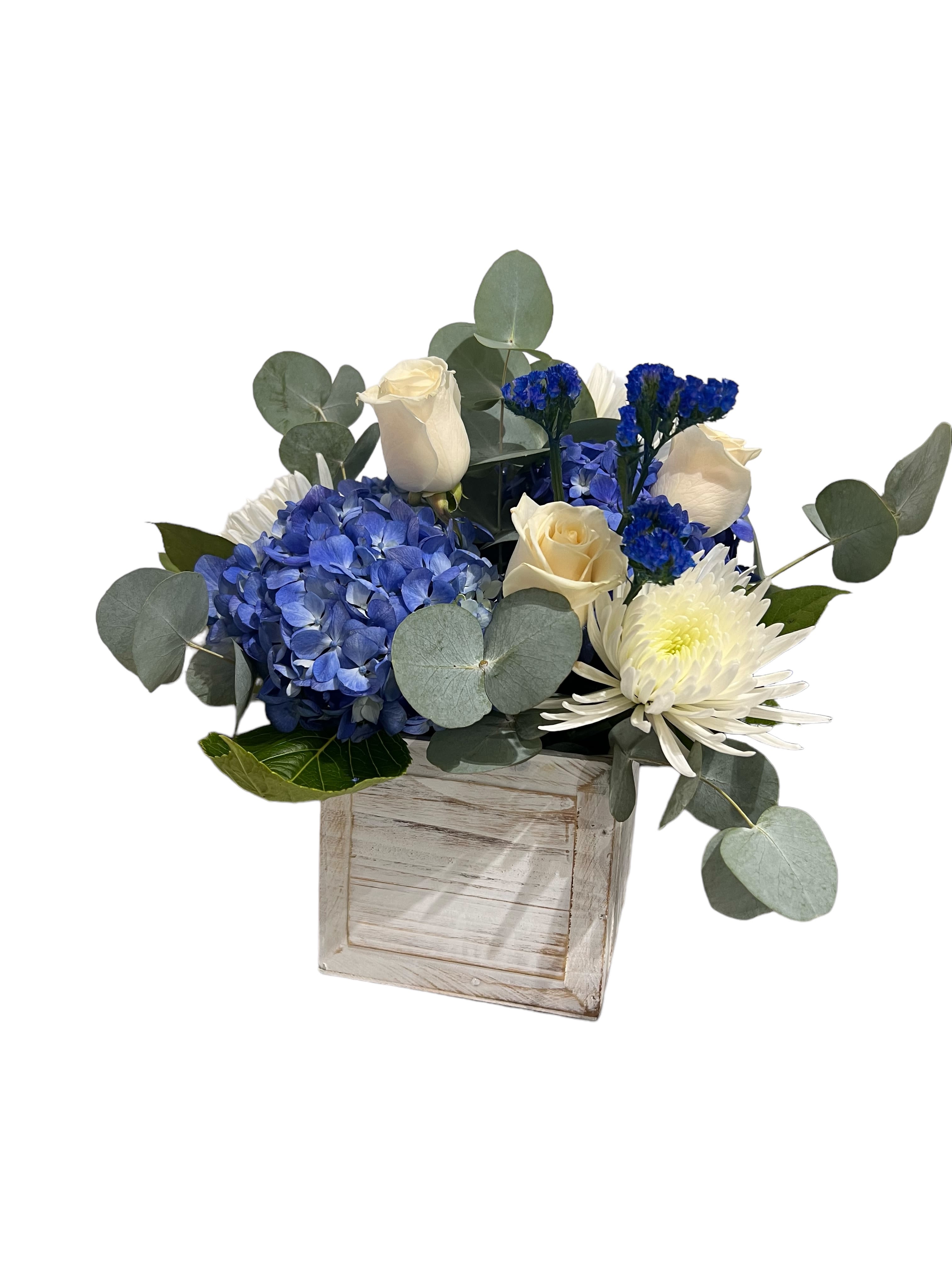 Whispering Waves - Wooden box filled with white and blue like the ocean waves using, fugi, eucalyptus, white rose and shocking blue hydrangea 