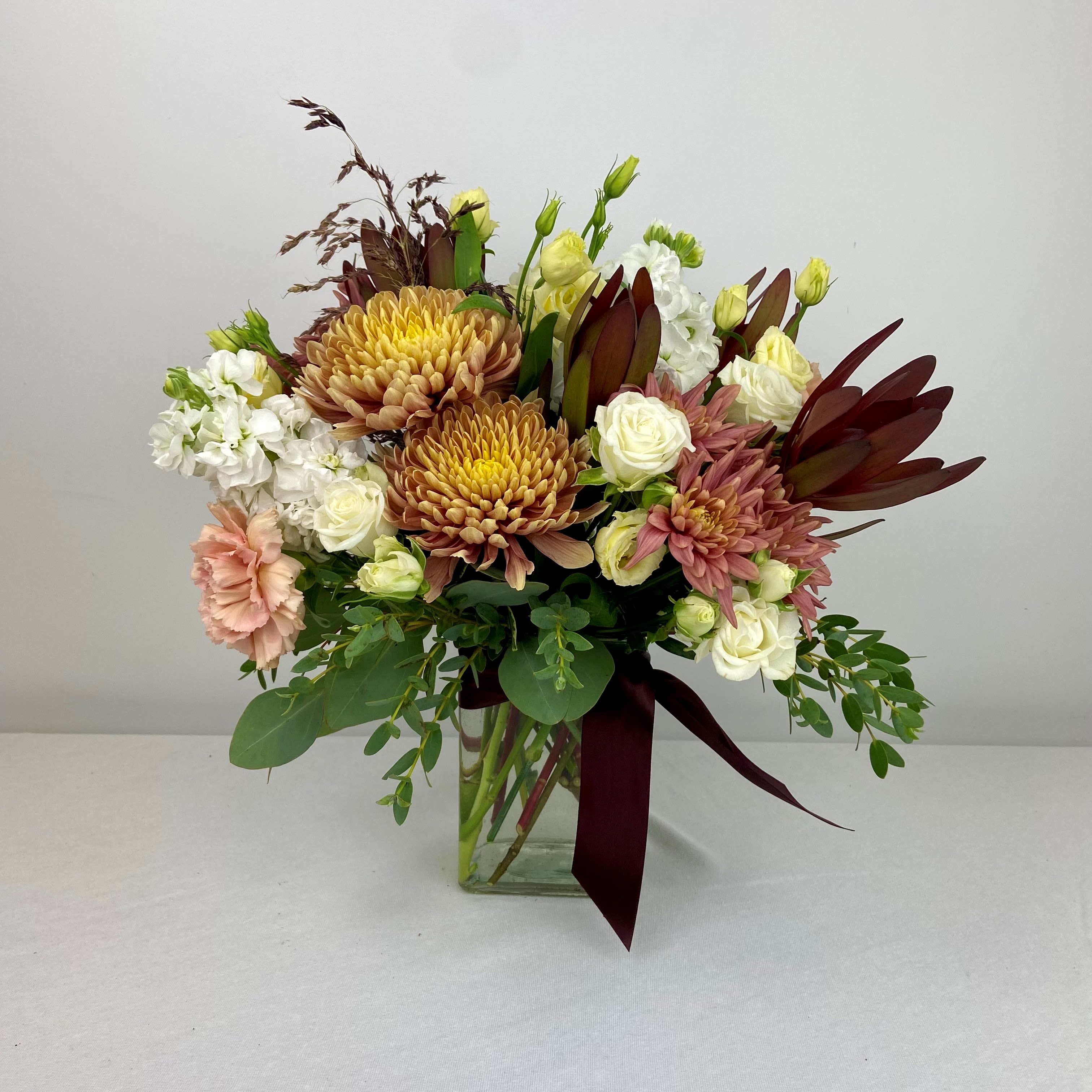 Pastel Autumn Beauty - Pastel corals/yellows paired with burgundy and white flowers