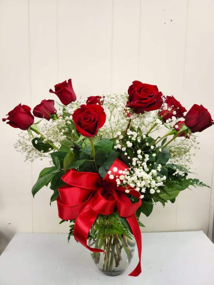 Classic Dozen Red Roses Classic Dozen Red Roses - Beautifully arranged roses with baby's breath and a bow. Perfect to show your loved ones how much you care!
