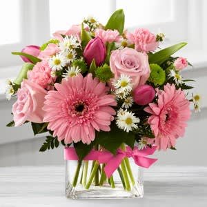 Popping Pinks Cube Vase Arr - Cluster of seasonal flowers mixed shades of pink and white arranged in a clear glass cube vase.