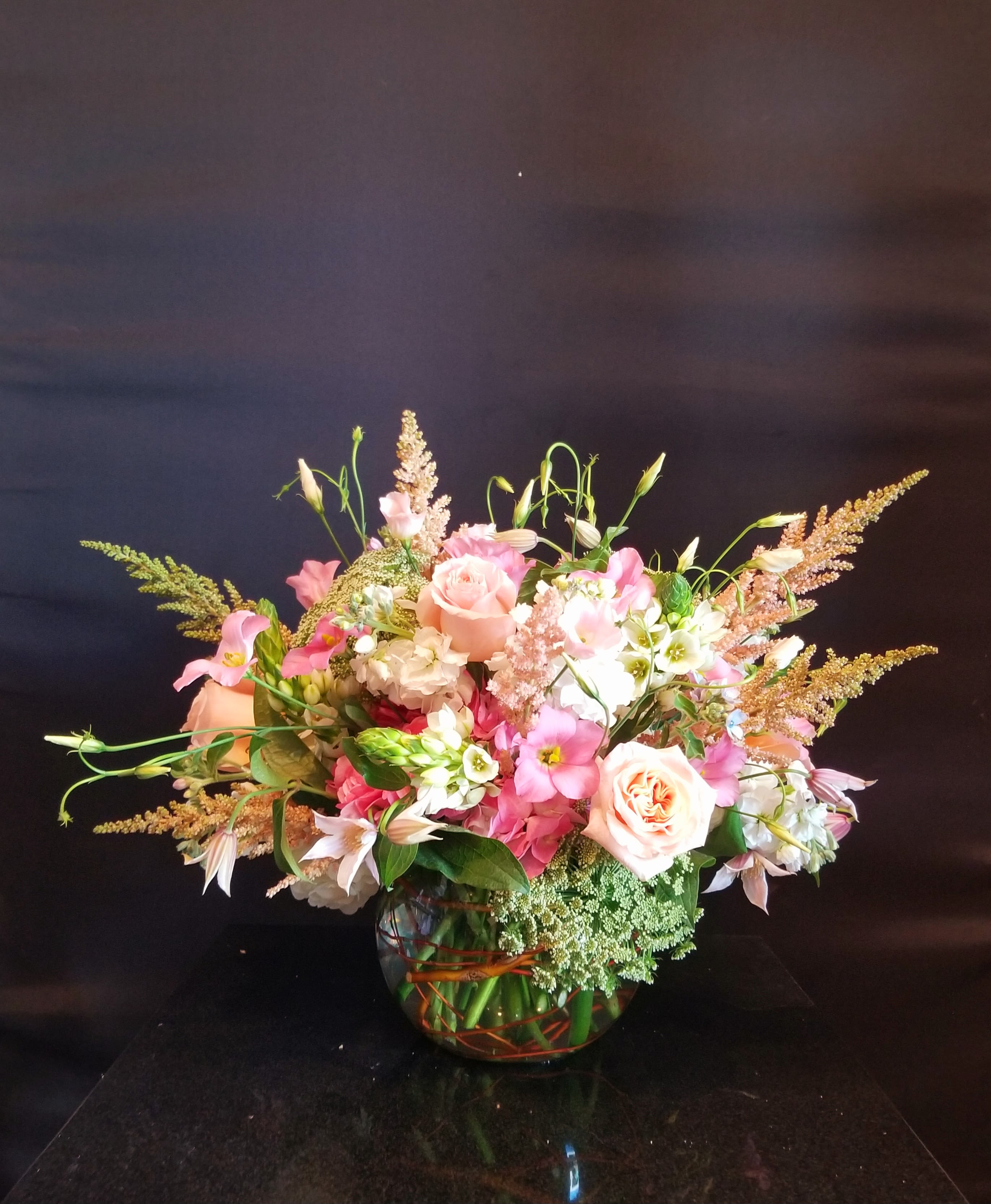Pink Plush  - Roses, snapdragon and astilbe make for a great start to a bountiful flower arrangement. If you love peonies as much as we do, ask us if they’re in season and we can special order them, and make this a premium arrangement!