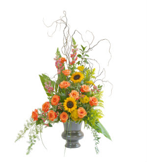 Heaven''s Sunset Large Urn Heaven''s Sunset Large Urn - The colors of sunset are evident in this urn filled with Sunflowers Roses and accents of other premium flowers and foliage. 16"Wide by 34" High As Shown : HI-F703