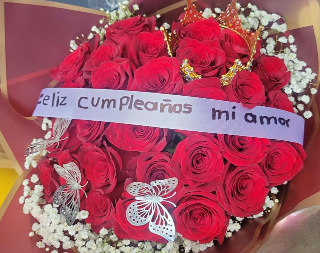 Happy Birthday Buchon  - it is made with: 30 red roses 4 baby breath 1 big crown 3 silver/gold butterflies banner on bow (happy birthday my love.) wrapped with, wine color paper 