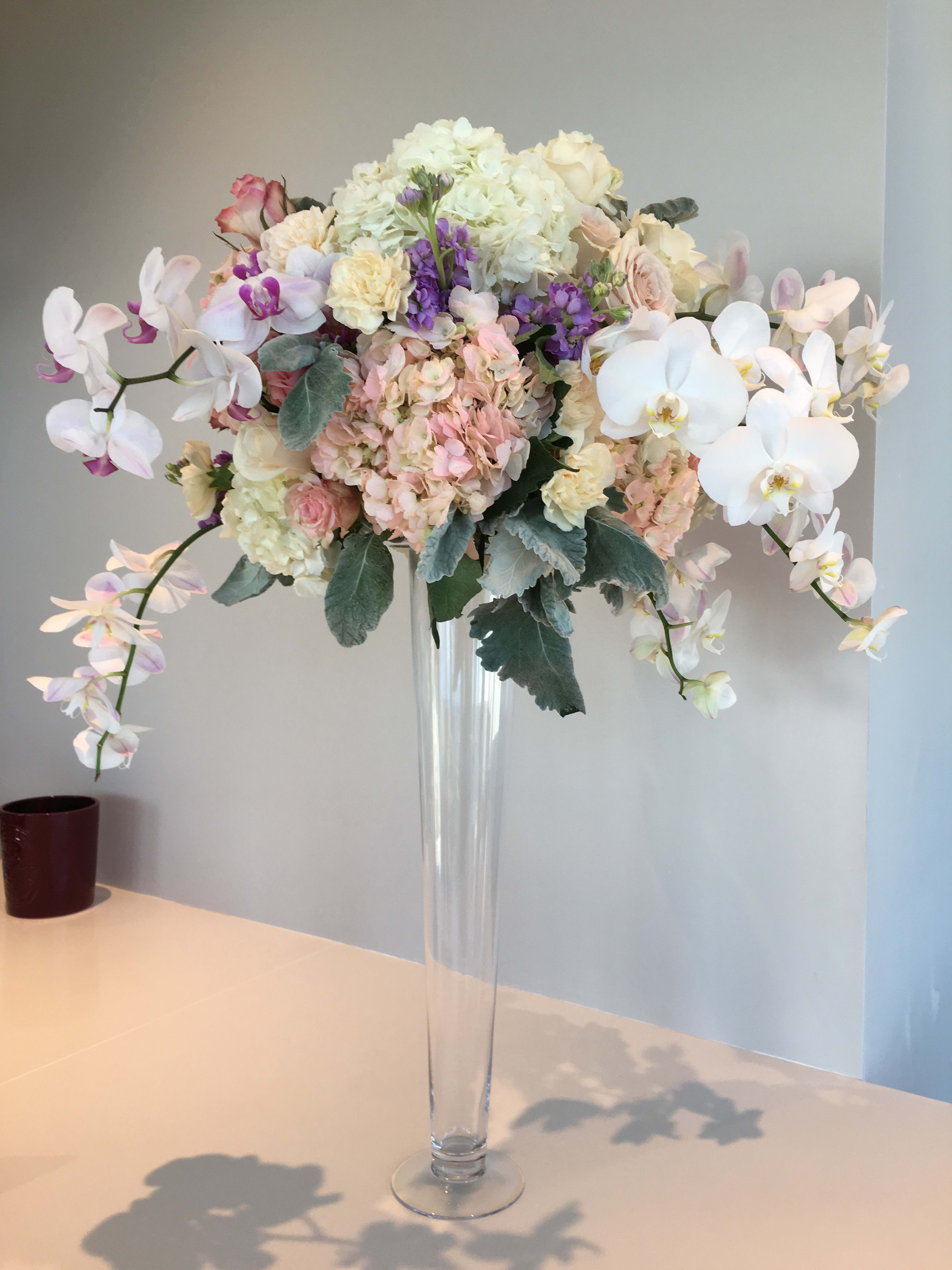 #45 Show stealing center piece #45 Show stealing center piece - this arrangement is for center piece for parties, events. some special occasions. your choice of colors. designers will create one of the kind floral piece. call as for questions