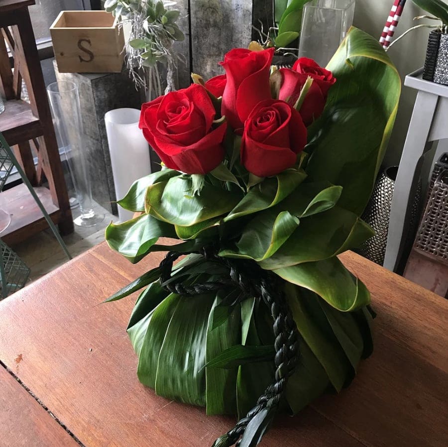 #46 PUOLU WITH ROSE/ TI LEI - Puolu with roses and ti leaf lei. we provide service to wrap ashes   (please call for questions)