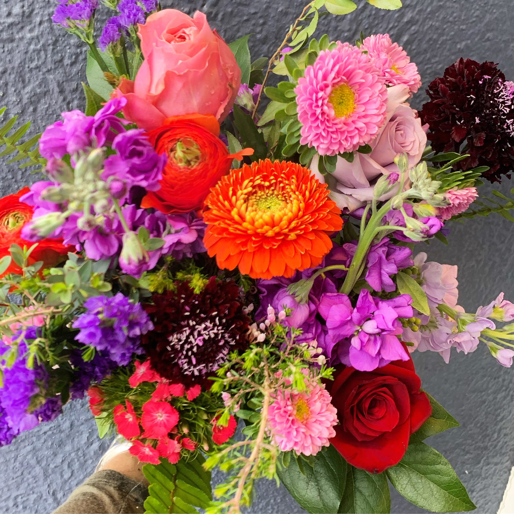 Custom Wrapped Bouquet - An excellent gesture for any flower lover!  In the Garden will use seasonal fresh blooms in a complimentary color scheme that any recipient will surely admire. Inquire about our Floral Subscriptions too!