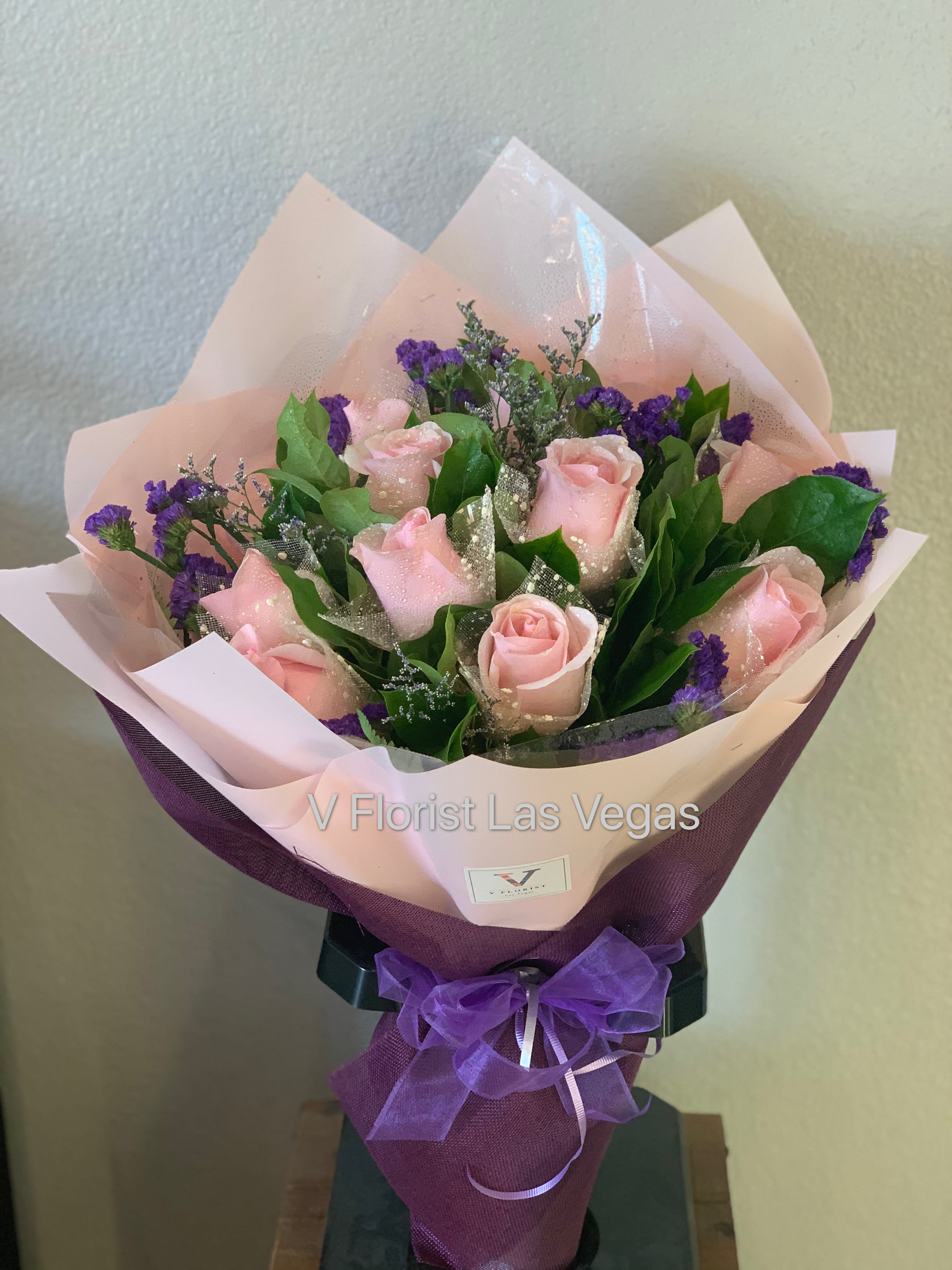 Deluxe Pink Wrapped Bouquet - Choice of 12 pink roses with fillers. Wrapped individually in a Deluxe style bouquet