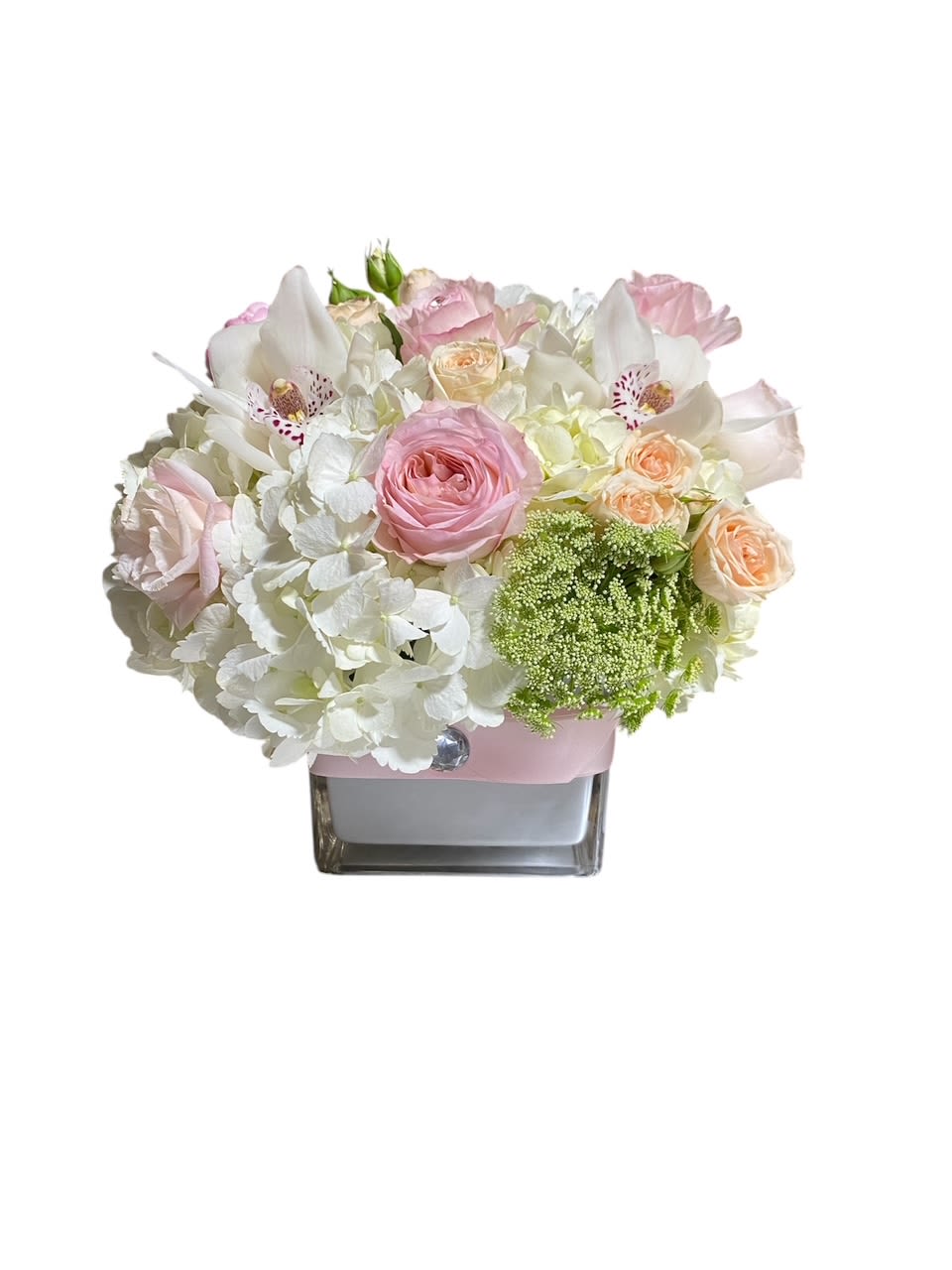 Pastel Symphony - Classic and Beautiful, this arrangement whispers luxury. Soft pinks, whites and creams come together to create an appealingly feminine gift. Perfect for welcoming a new baby, wishing happy birthday or saying congratulations.   APPROXIMATE DIMENSIONS: 15&quot; W X 15&quot; H    