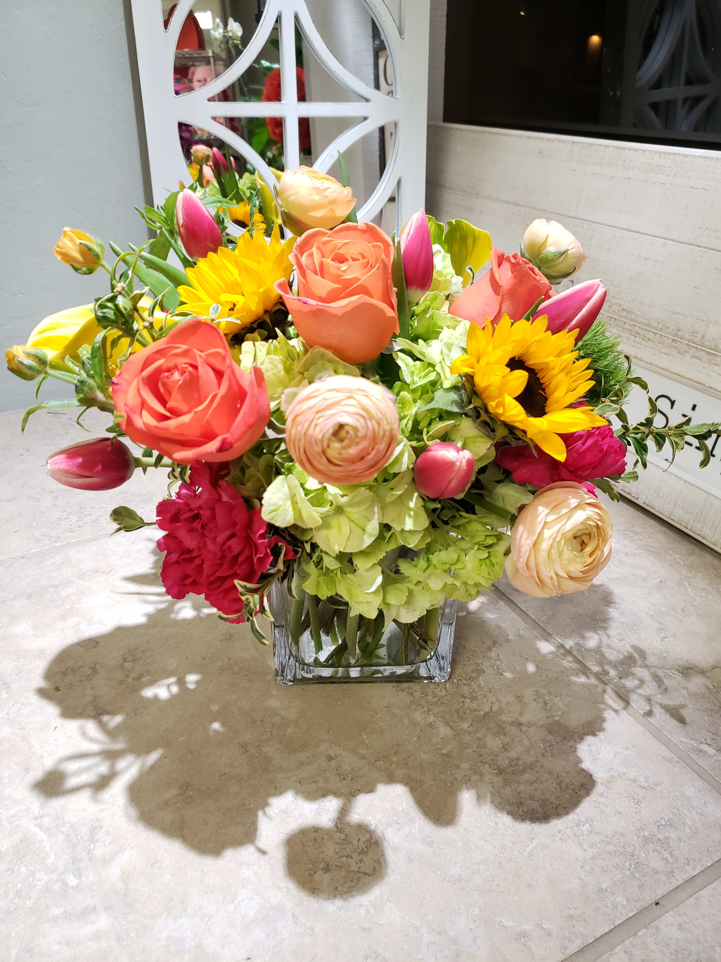 Starburst Cube - This burst of colors blooms is so fun filled with roses, tulips, ranunculus, hydrangeas and other in seasonal blooms always keeping color pallet shown.    