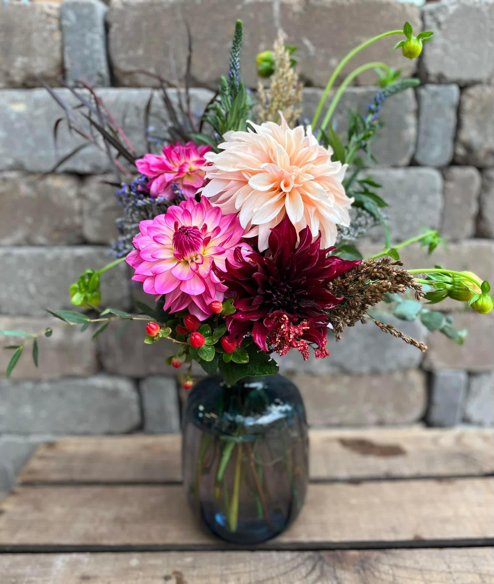 A Simpler Time A Simpler Time - A bouquet of vibrant blooms in a vase. This arrangement is sure to brighten a loved one's day.