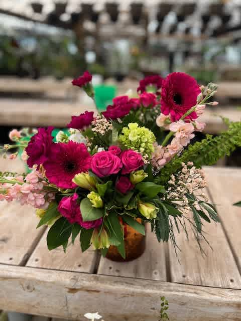 Hold Onto the Memories Hold Onto the Memories - An array of various shades of pink and green, featuring gerbera daisies, snap dragons and spray roses.