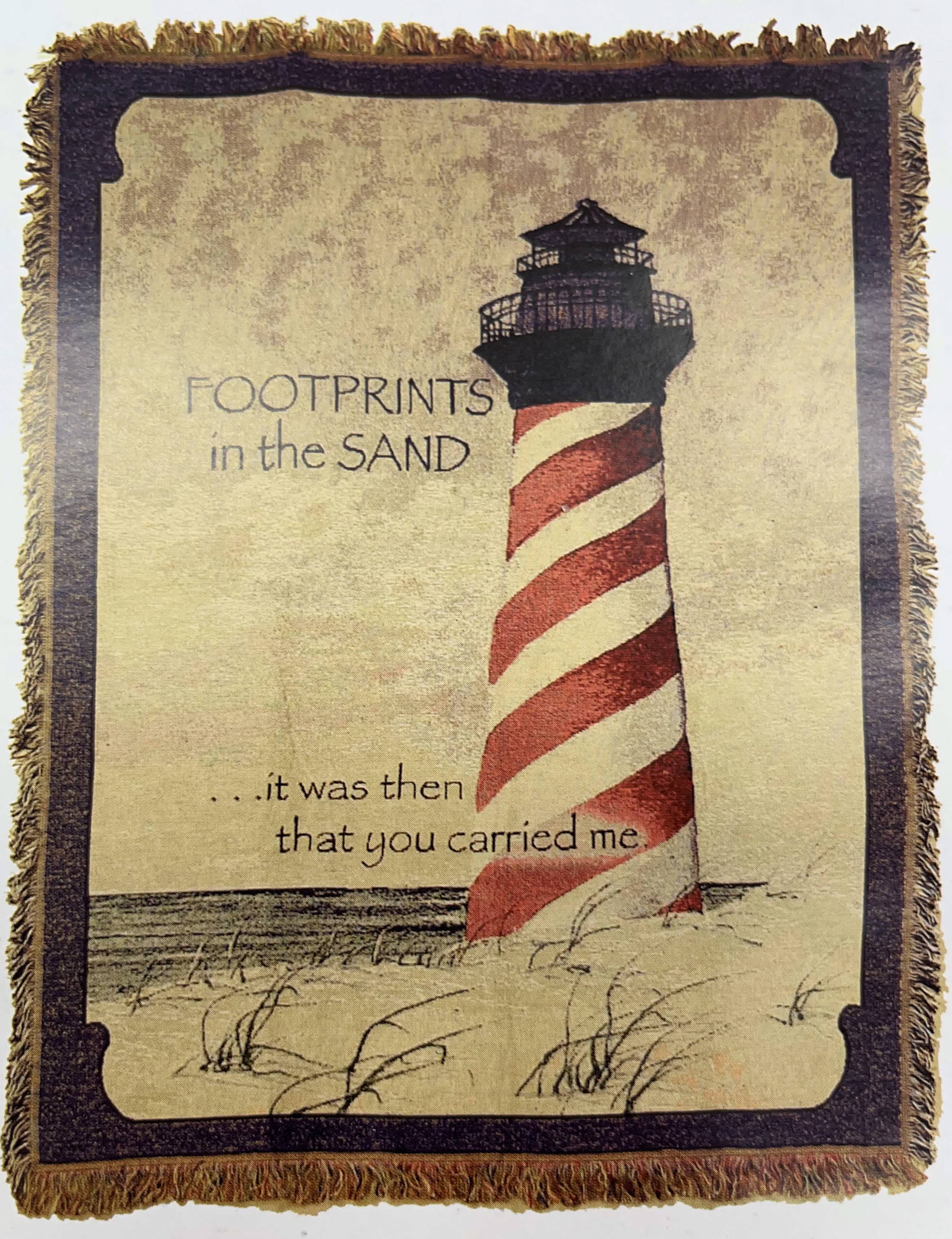 Sympathy Throw, Lighthouse with Footprints in the Sand Sympathy Throw, Lighthouse with Footprints in the Sand - A beautiful woven throw depicting a coastal scene with a red, black and white striped lighthouse, with a portion of Footprints in the Sand. . We've mounted the throw on a 60 inch wire easel for dispay, and added a coordinating satin ribbon bow at the top. The throw measures 48in.by 60in. The throw itself is $74.95, if you care to display on an easel at the service, the easel is $26