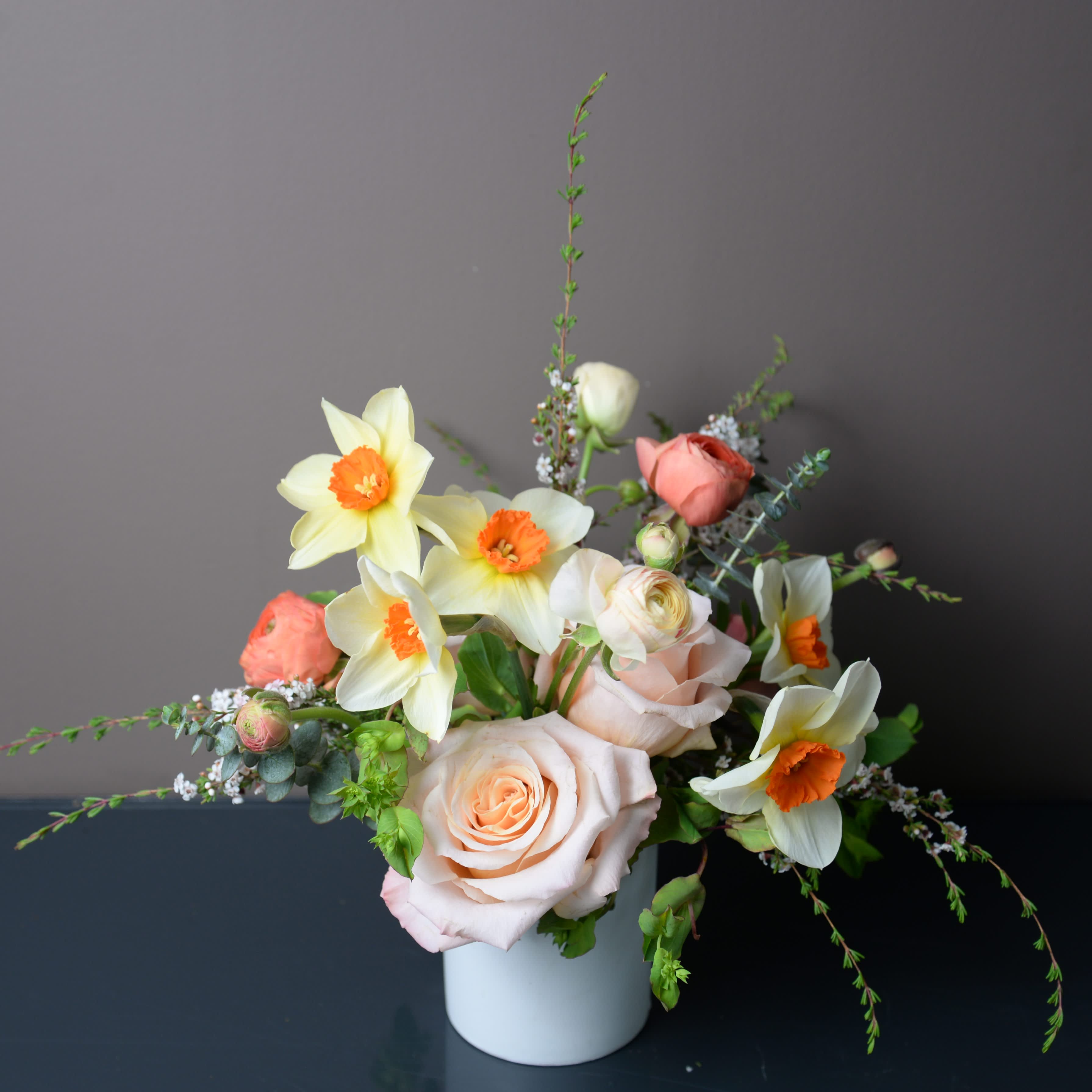 Seasonal Treasures Mini - Our designers will choose a beautiful selection of seasonal blooms. The standard size is perfect for a dining table of 2-4 or a small coffee table.